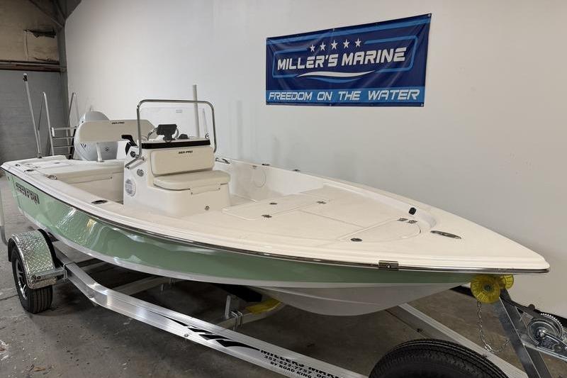 2026 Sea Pro 172 Bay boat on trailer at Miller's Marine showroom.