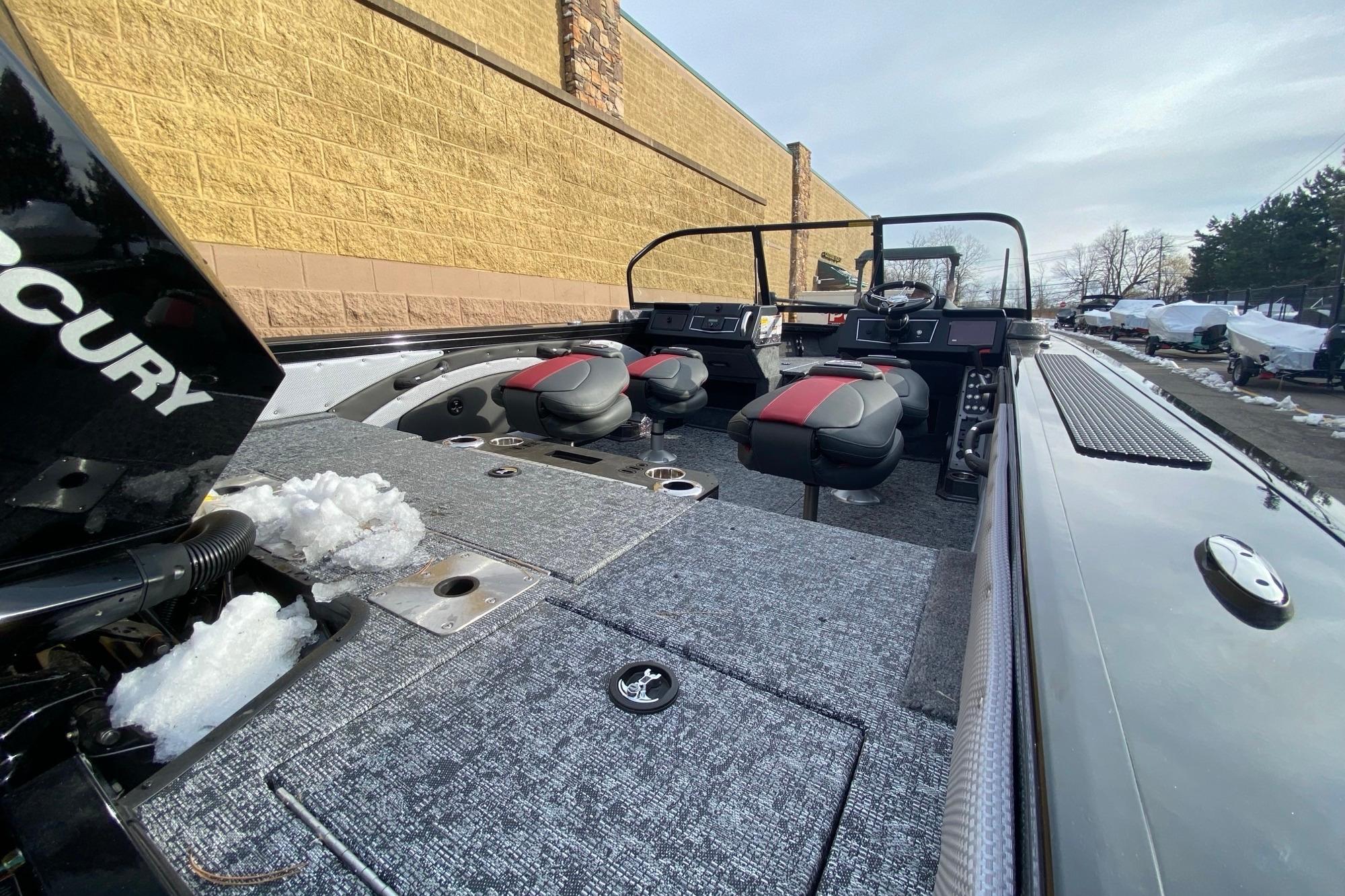 2026 Ranger VX1888 WT boat interior with seating and snow, parked outdoors.