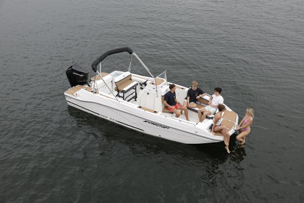 2025 Starcraft SVX 211 OB CC boat with people enjoying a day on the water.