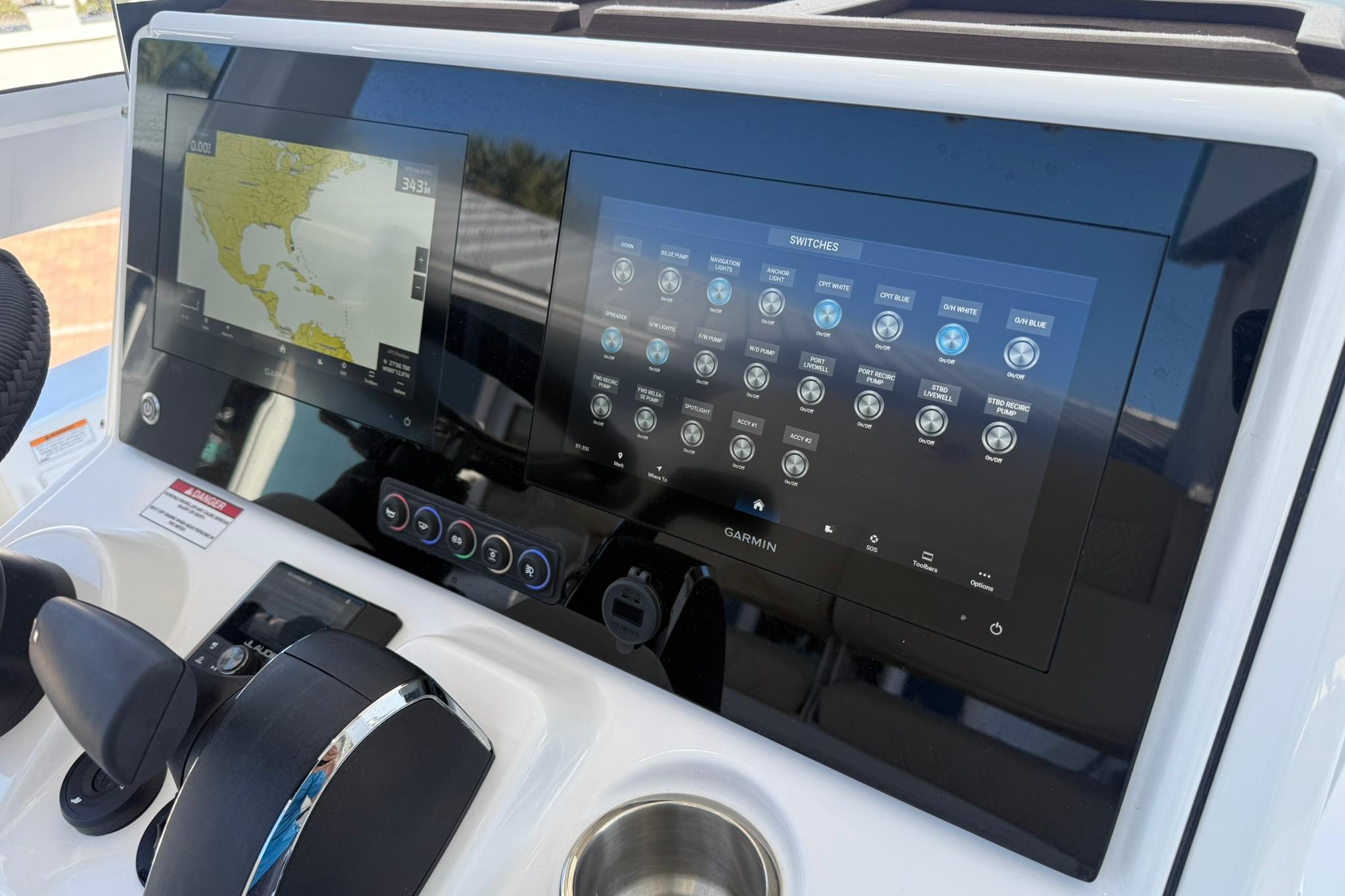 2026 Crevalle 24 HCO boat dashboard with Garmin navigation and control screens.
