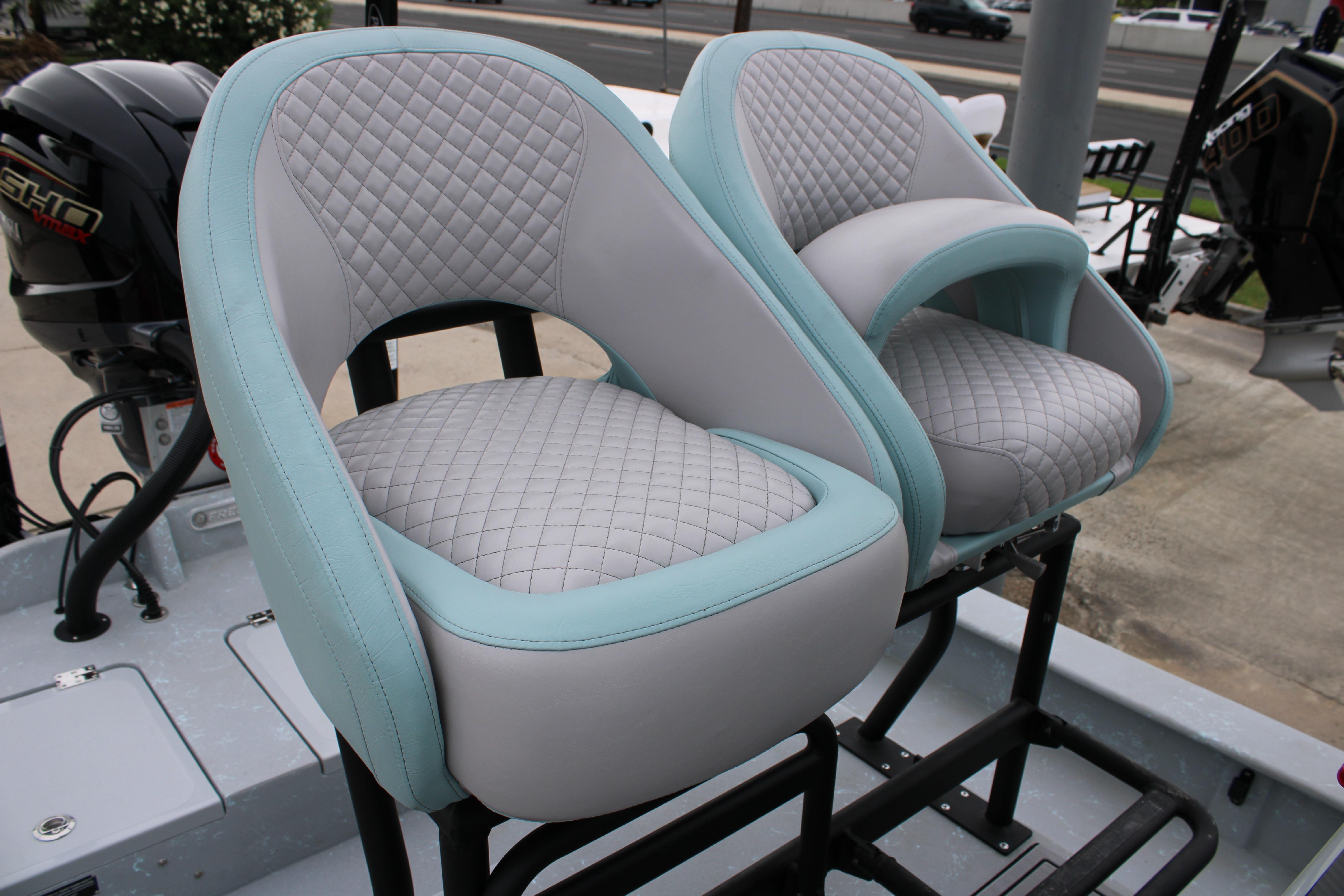 Luxury seating on 2026 Freedom Boats 24 Defender, featuring quilted upholstery and modern design.