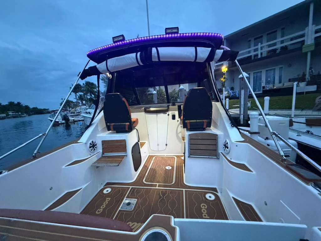 2001 Bayliner 2452 Ciera Classic docked at dusk.