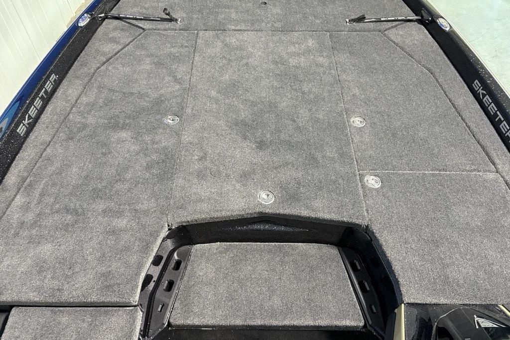 2026 Skeeter ZXE21 boat deck with gray carpet and storage compartments.