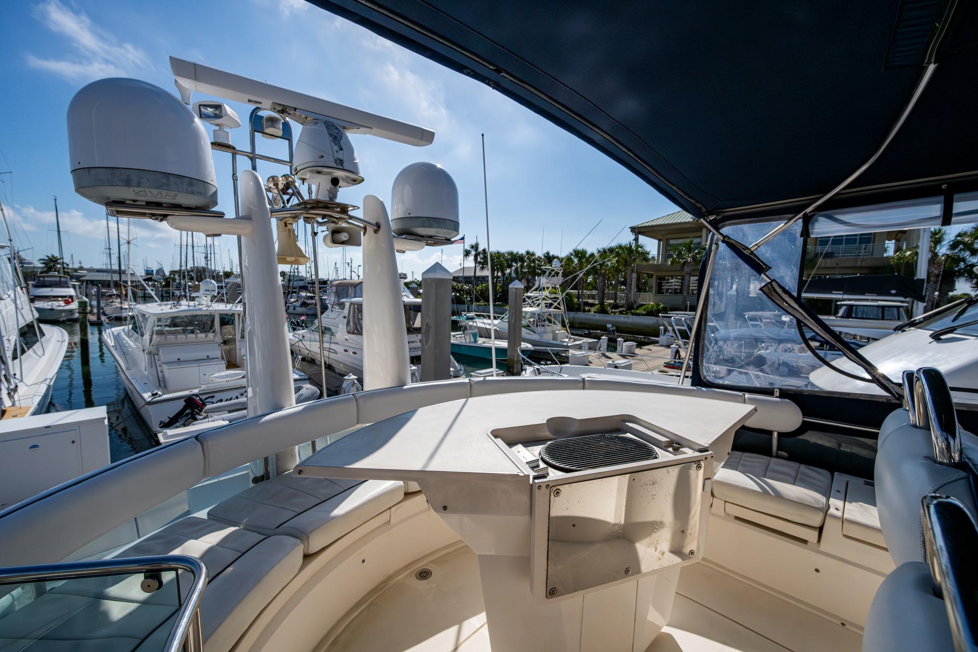 Flybridge view of 2000 Fairline Squadron 52 yacht docked at marina.
