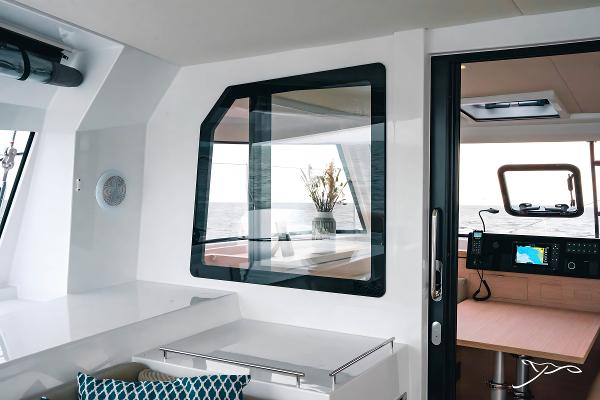 Interior of 2025 Nautitech 40 Open catamaran, featuring modern design and navigation equipment.
