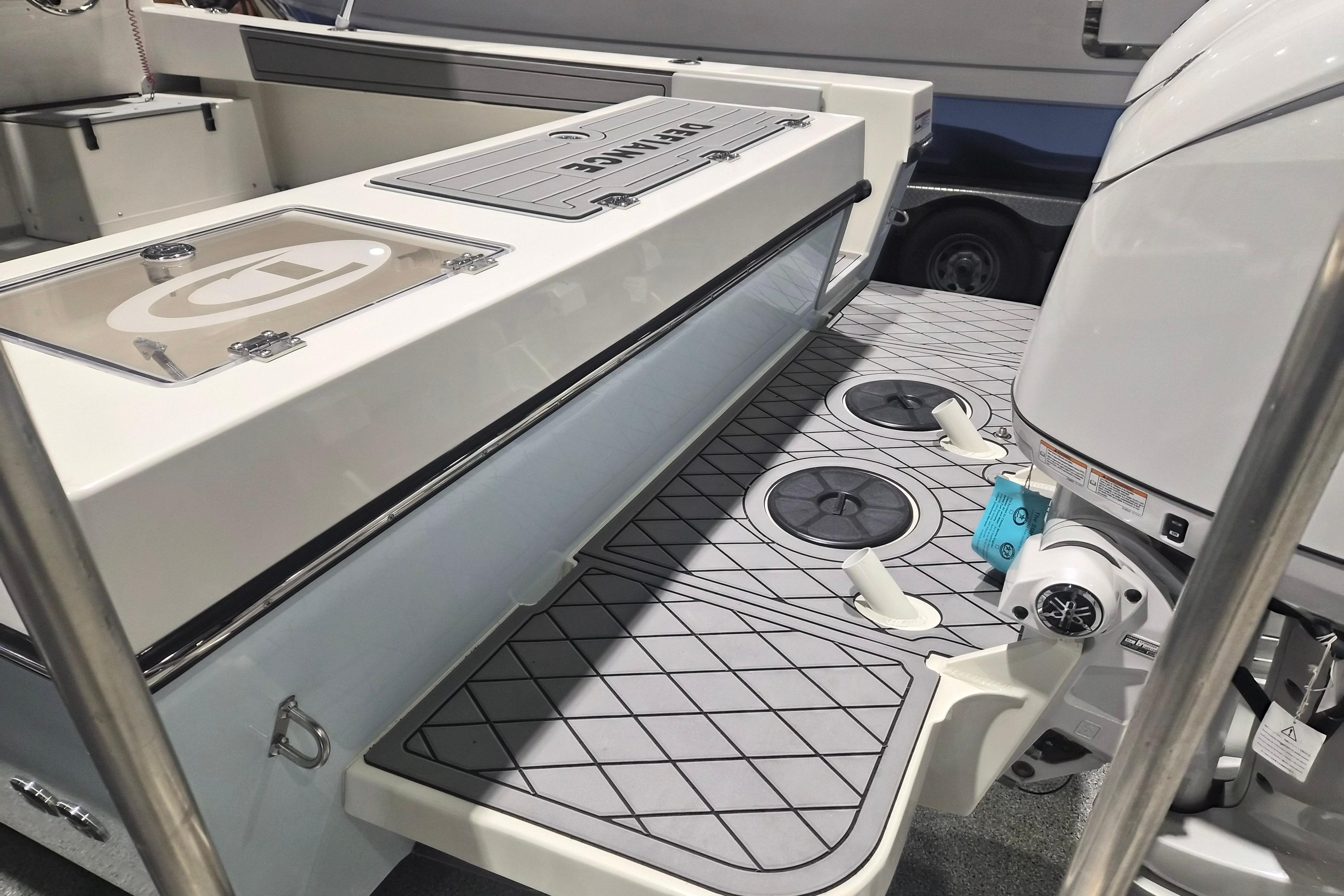 2026 Defiance Admiral 260 EX boat deck with storage compartments and modern design.