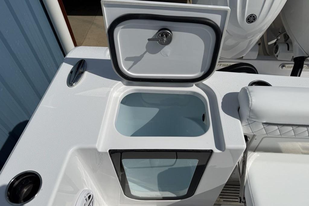 2026 Sportsman Open 252 Center Console boat with open storage compartment.