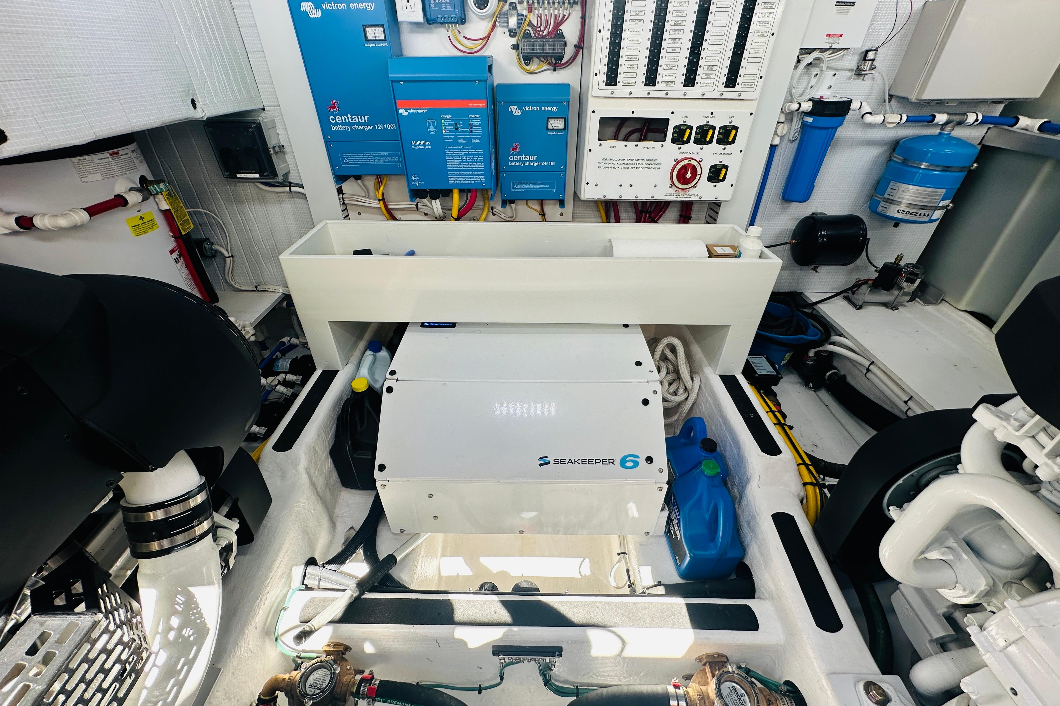 Engine room of 2025 Sabre 48 Salon Express with Seakeeper 6 stabilizer and electrical systems.