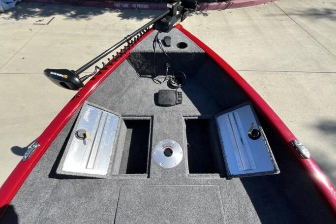 2025 Tracker Super Guide V-16 T boat deck with storage compartments and trolling motor.