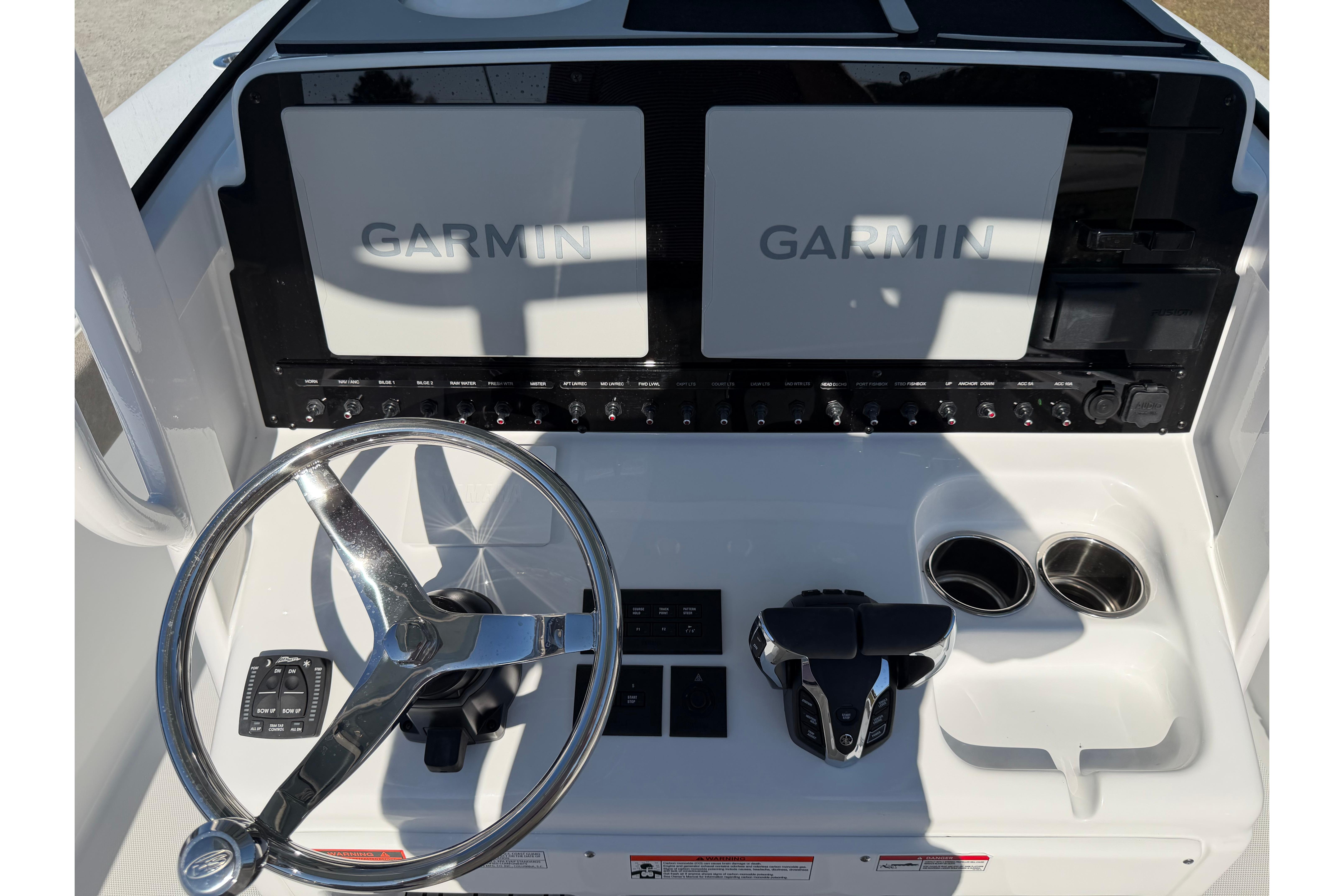 2026 Sea Hunt Ultra 275 Coffin Box dashboard with Garmin displays and steering wheel.