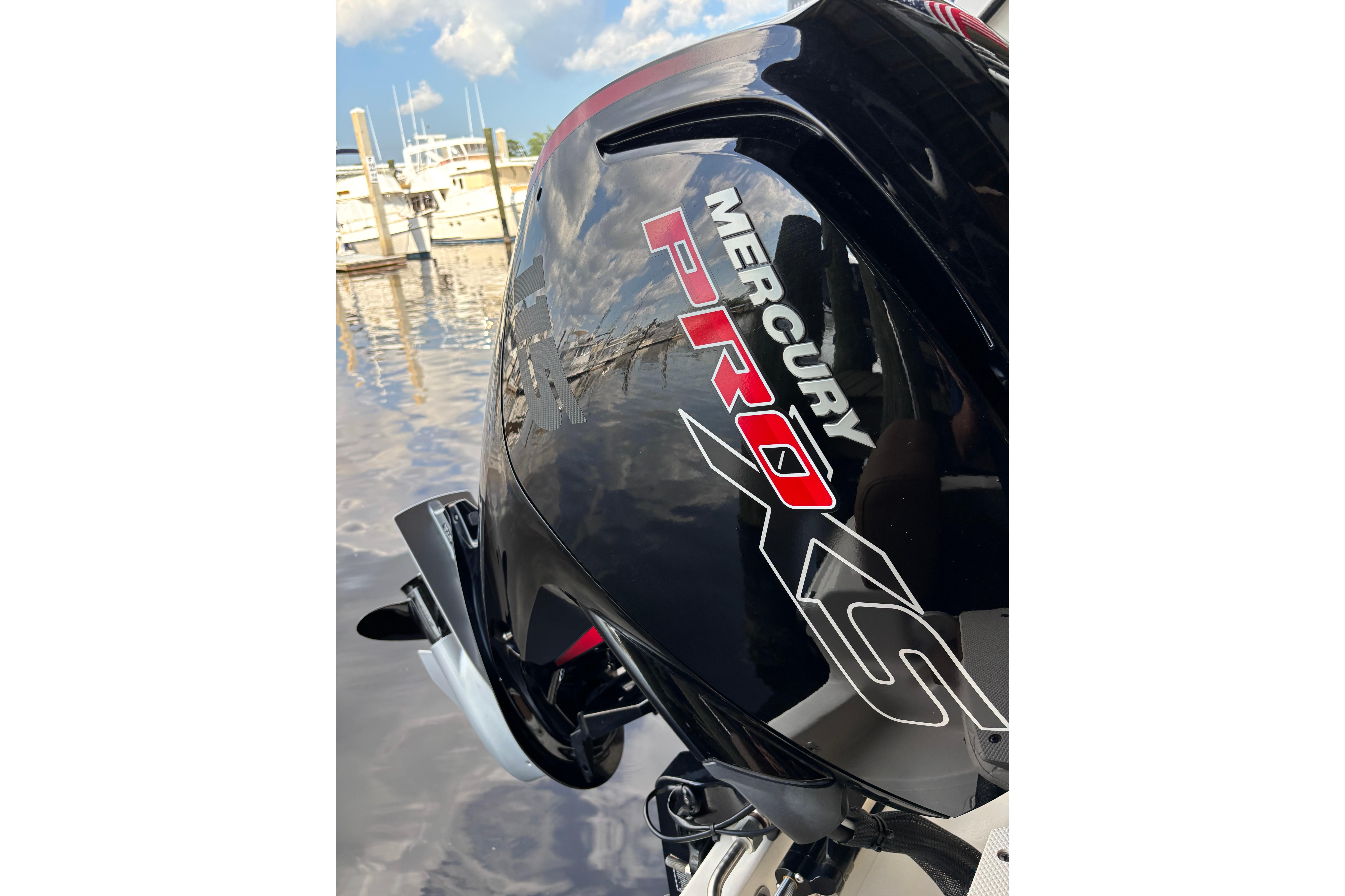 Mercury Pro XS engine on 2024 Pioneer 180 Islander boat at marina.