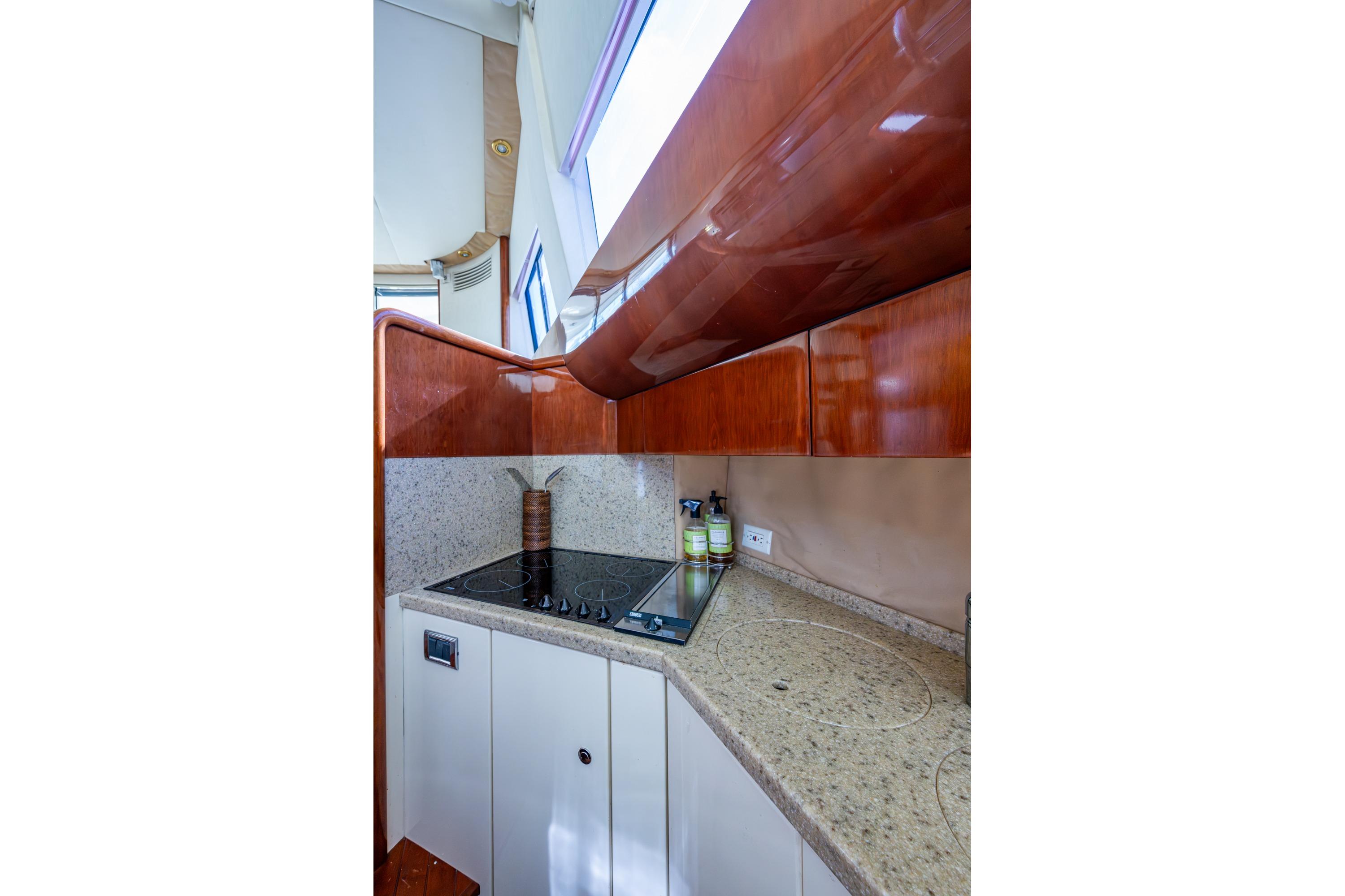 Luxurious kitchen area in 2000 Fairline Squadron 52 yacht with modern amenities.