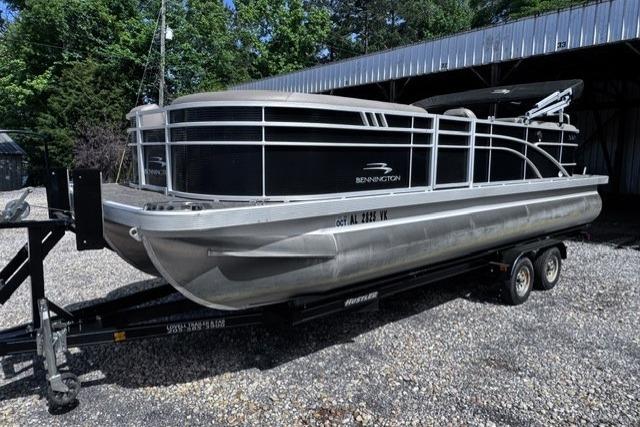 2021 Bennington 23 SSRX pontoon boat on trailer, parked outdoors.