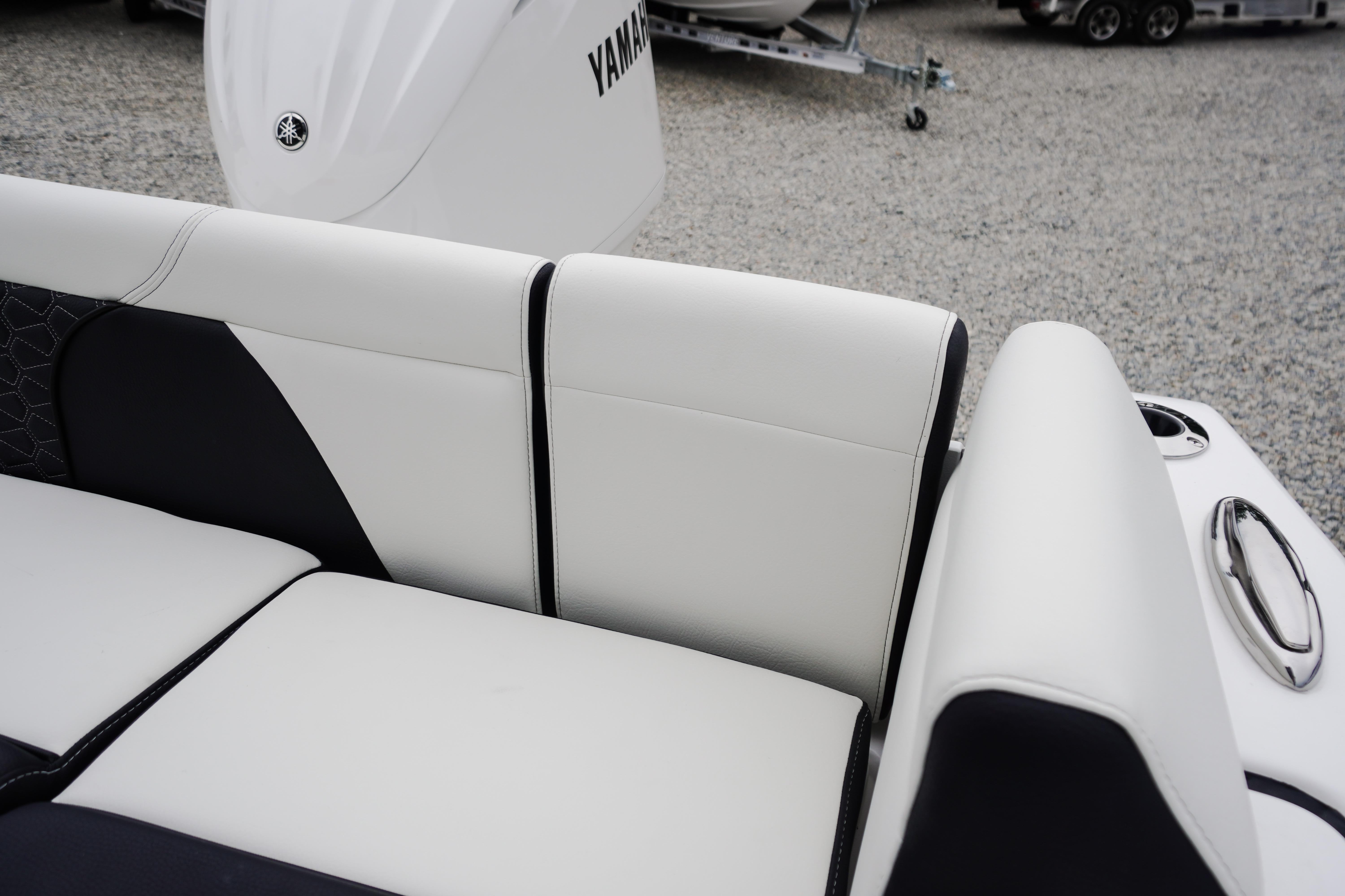 2026 Tidewater 232 SS boat with white and black seating, Yamaha engine visible.