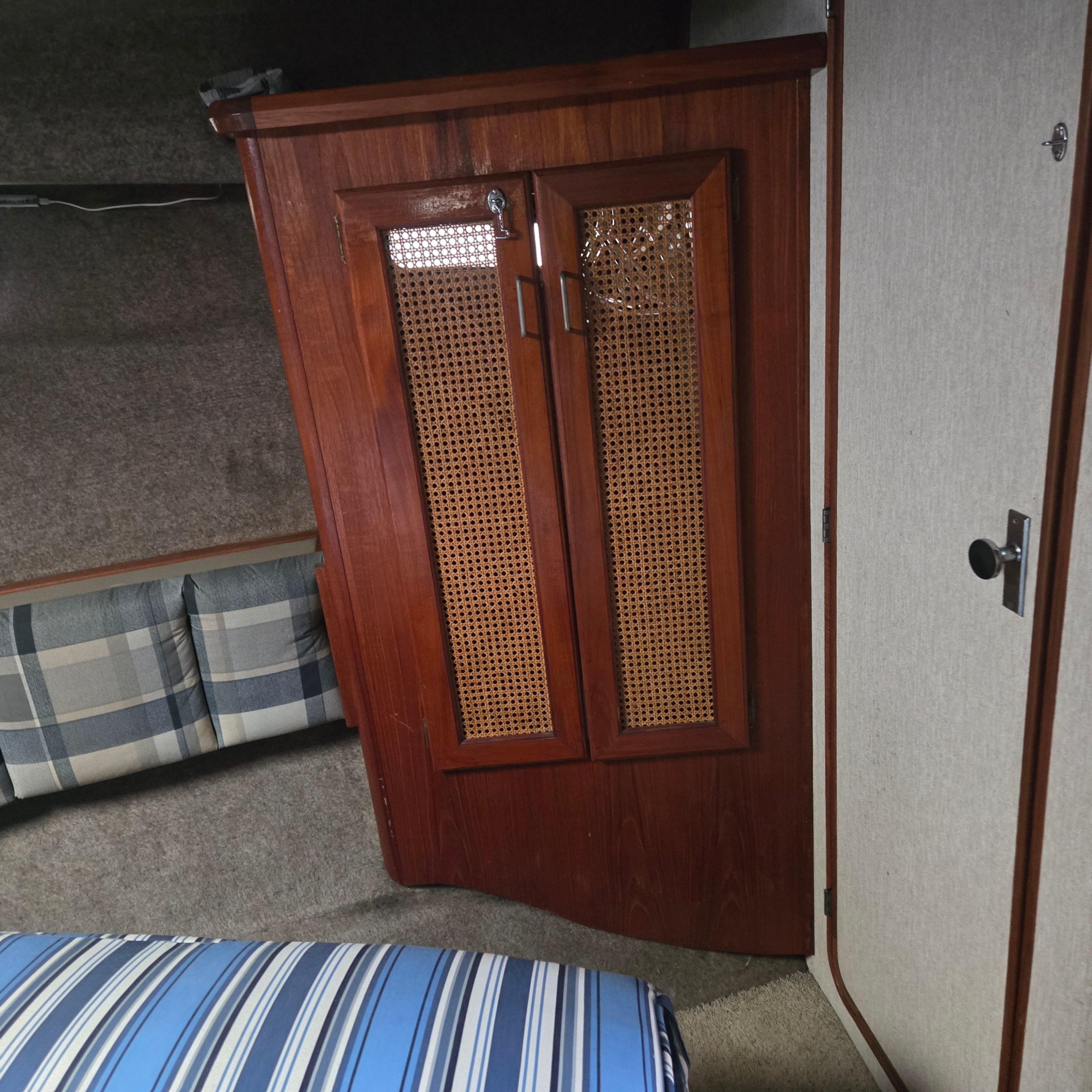 1984 Bayliner 3870 Motoryacht interior with wooden cabinetry.