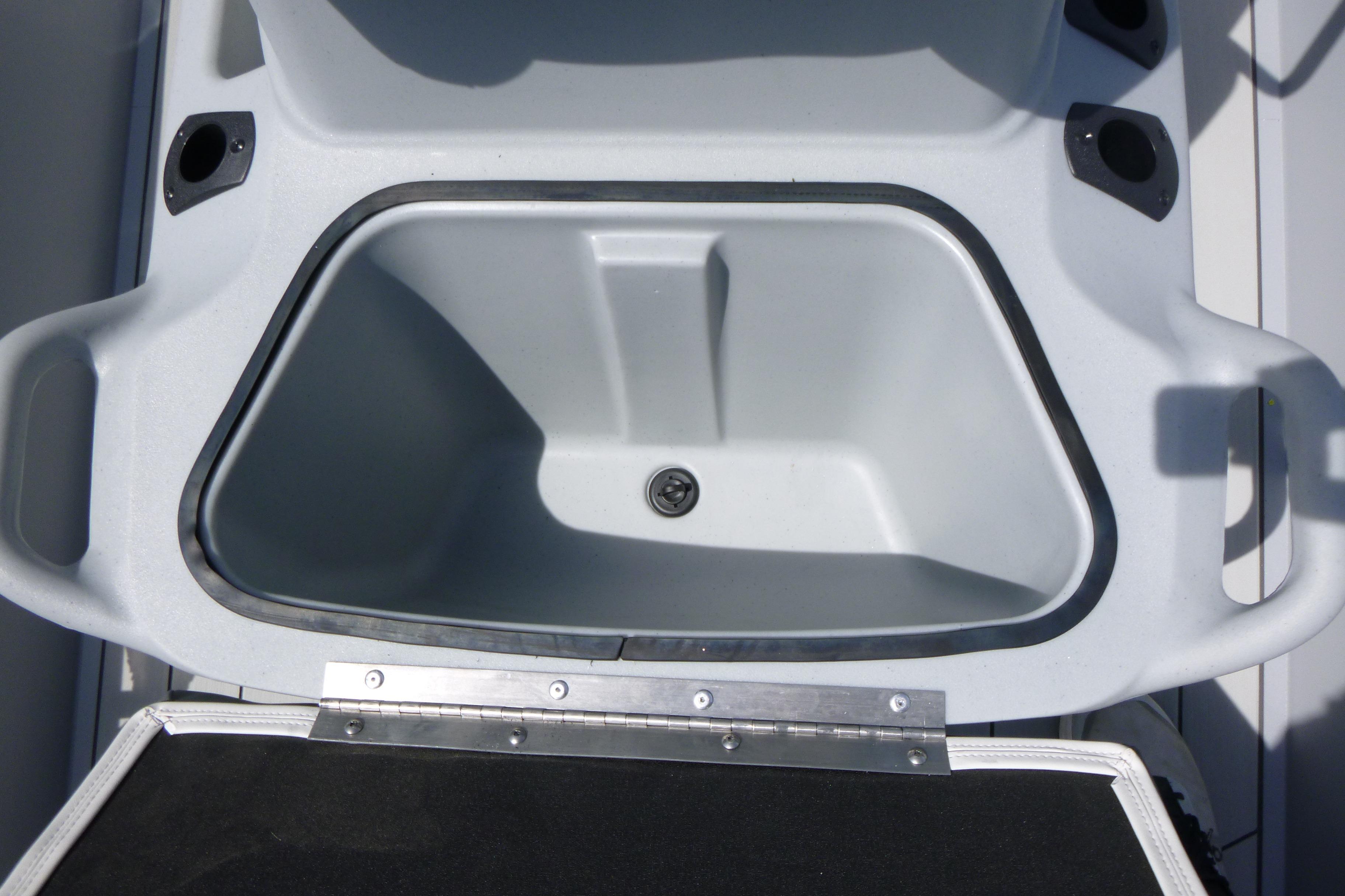 2026 Tracker Bass Tracker Classic CC livewell compartment, open and empty.