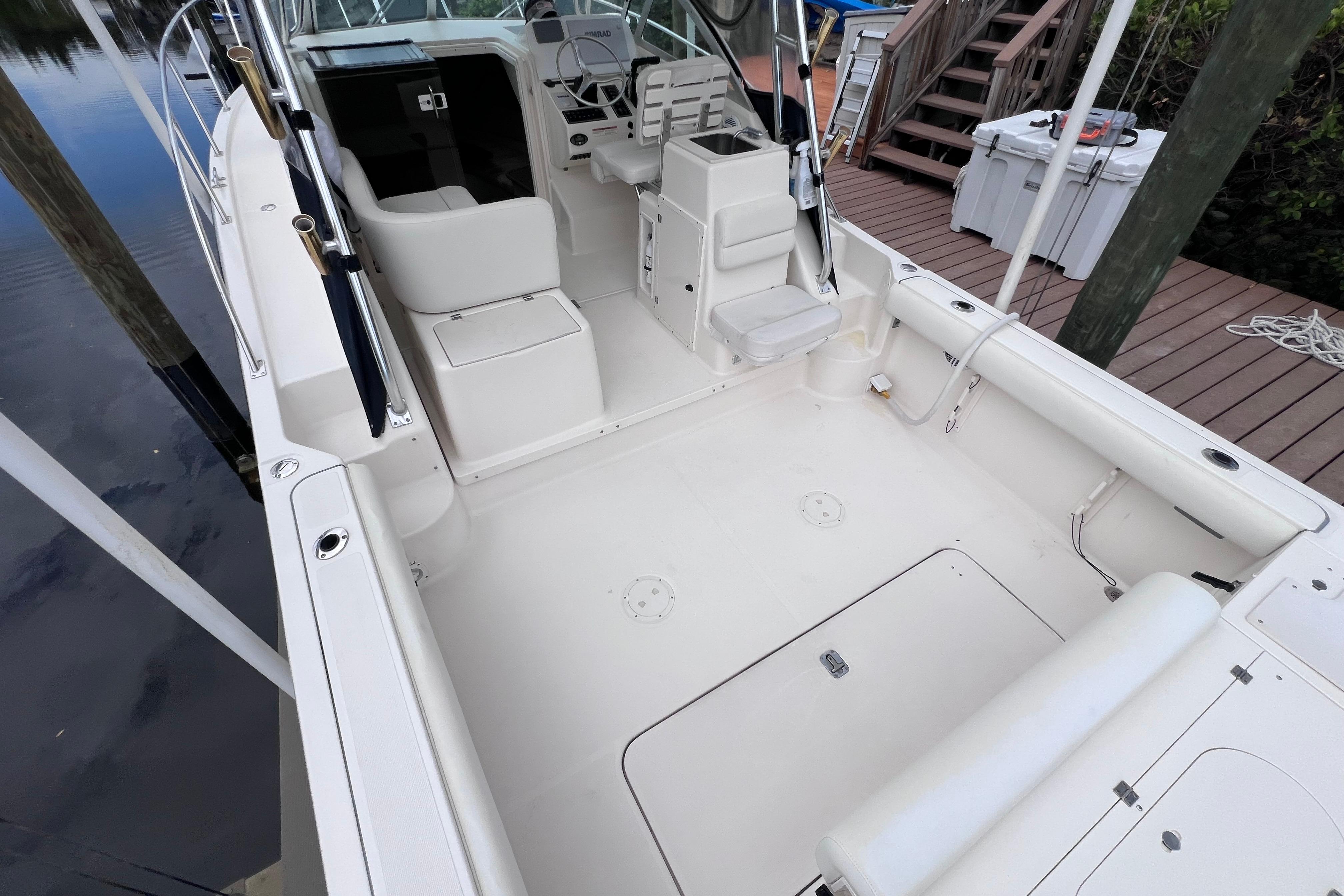 2005 Pursuit 3070 Offshore boat interior with spacious deck and seating area.