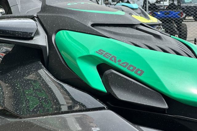 Close-up of a Sea-Doo PWC GTR 230 with green and black design.
