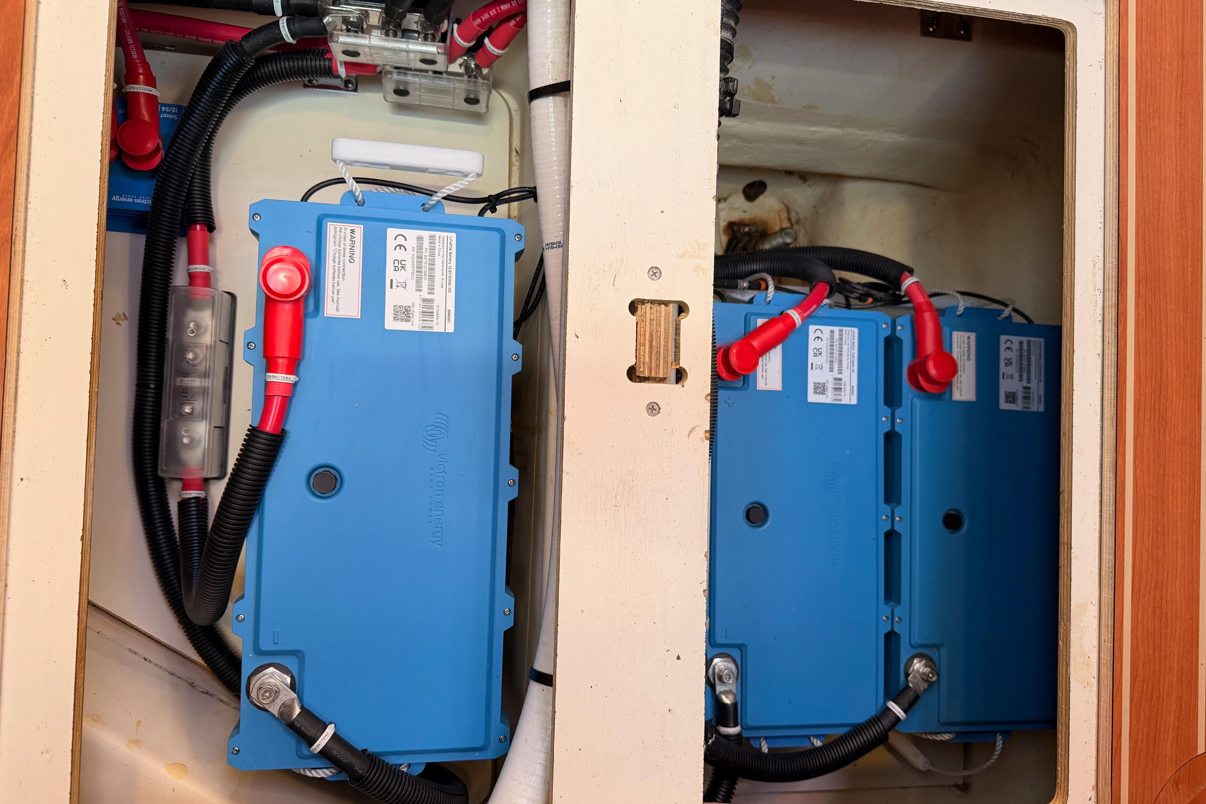 Electrical system of a 2008 Hunter 45 Deck Salon yacht, featuring blue battery units.