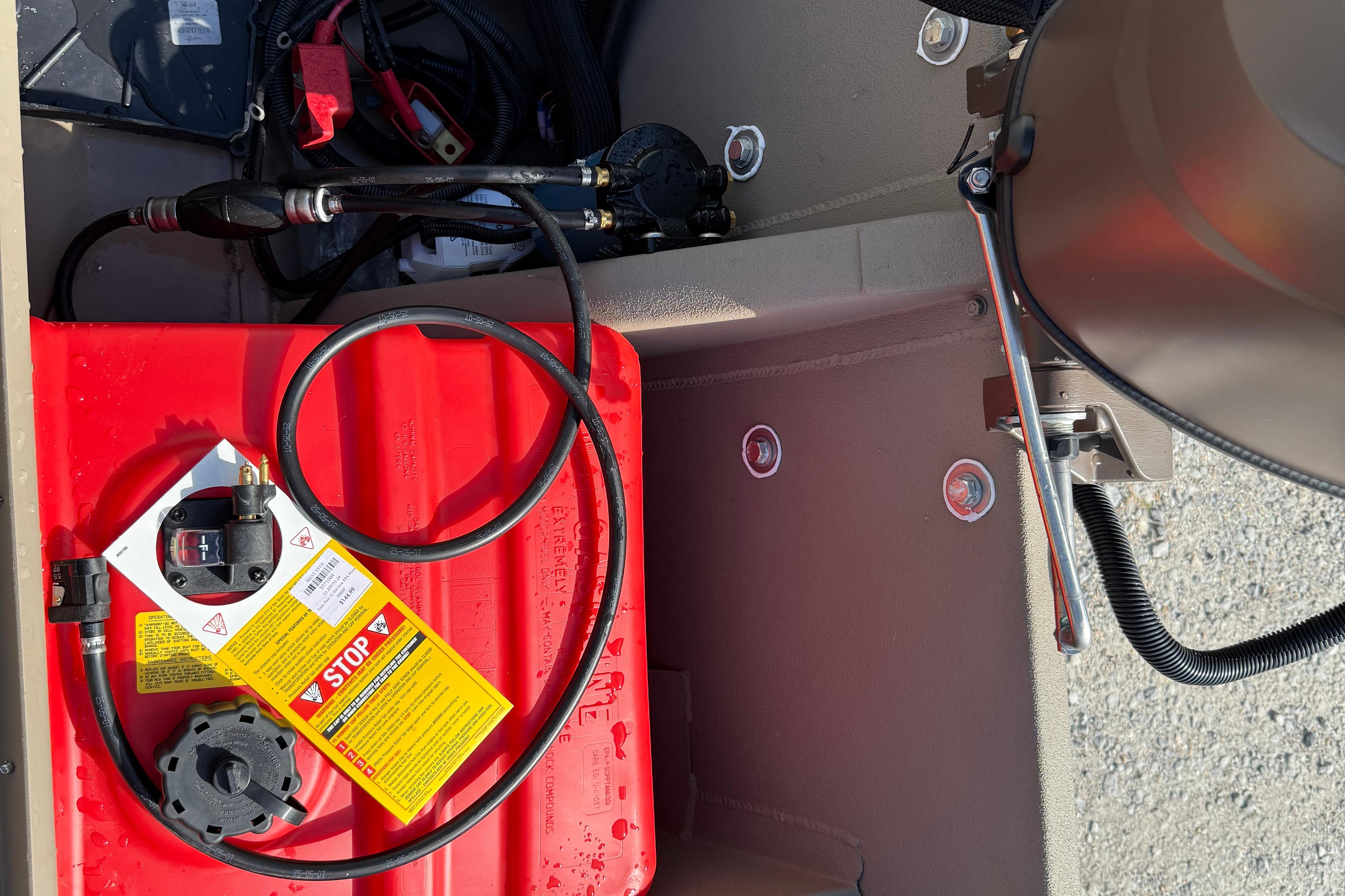 2025 Alweld 1756 V MARSH C.C. boat interior with red fuel tank and wiring.