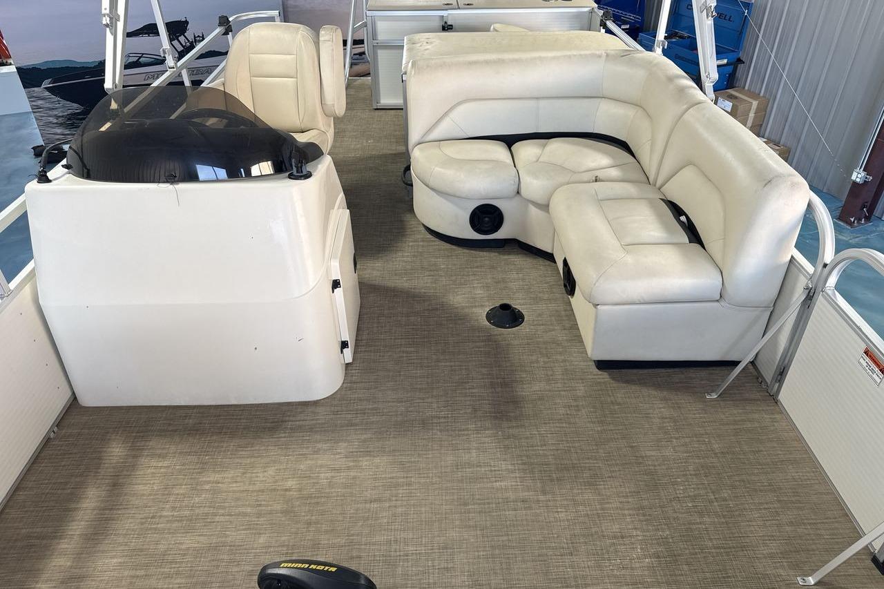 2018 Landau Alure 212 Fish boat interior with beige seating and helm.
