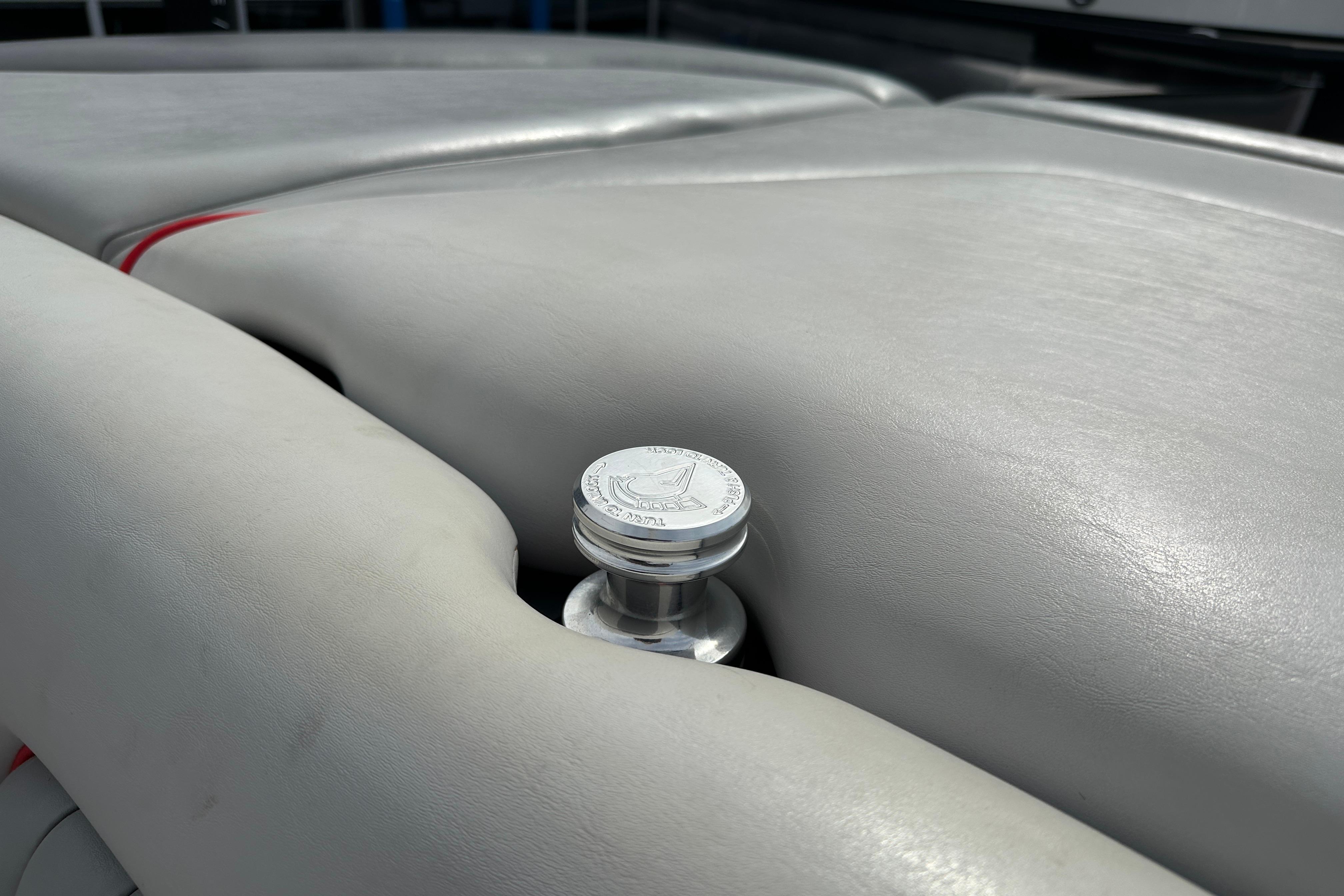 2008 Centurion Enzo SV240 boat interior with silver detailing and gray upholstery.