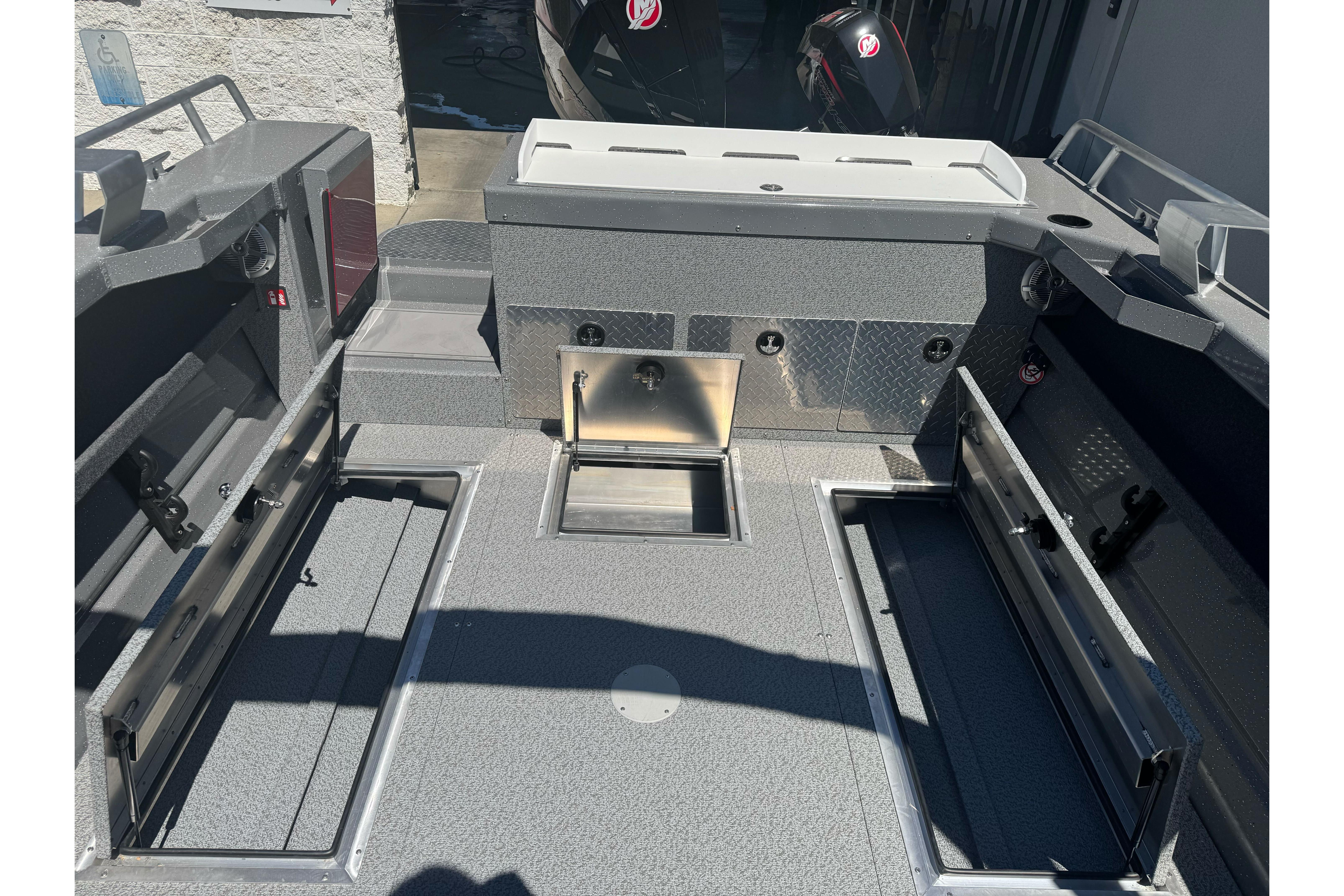 2026 Lund 210 Heavy Gauge boat interior with storage compartments and sleek design.