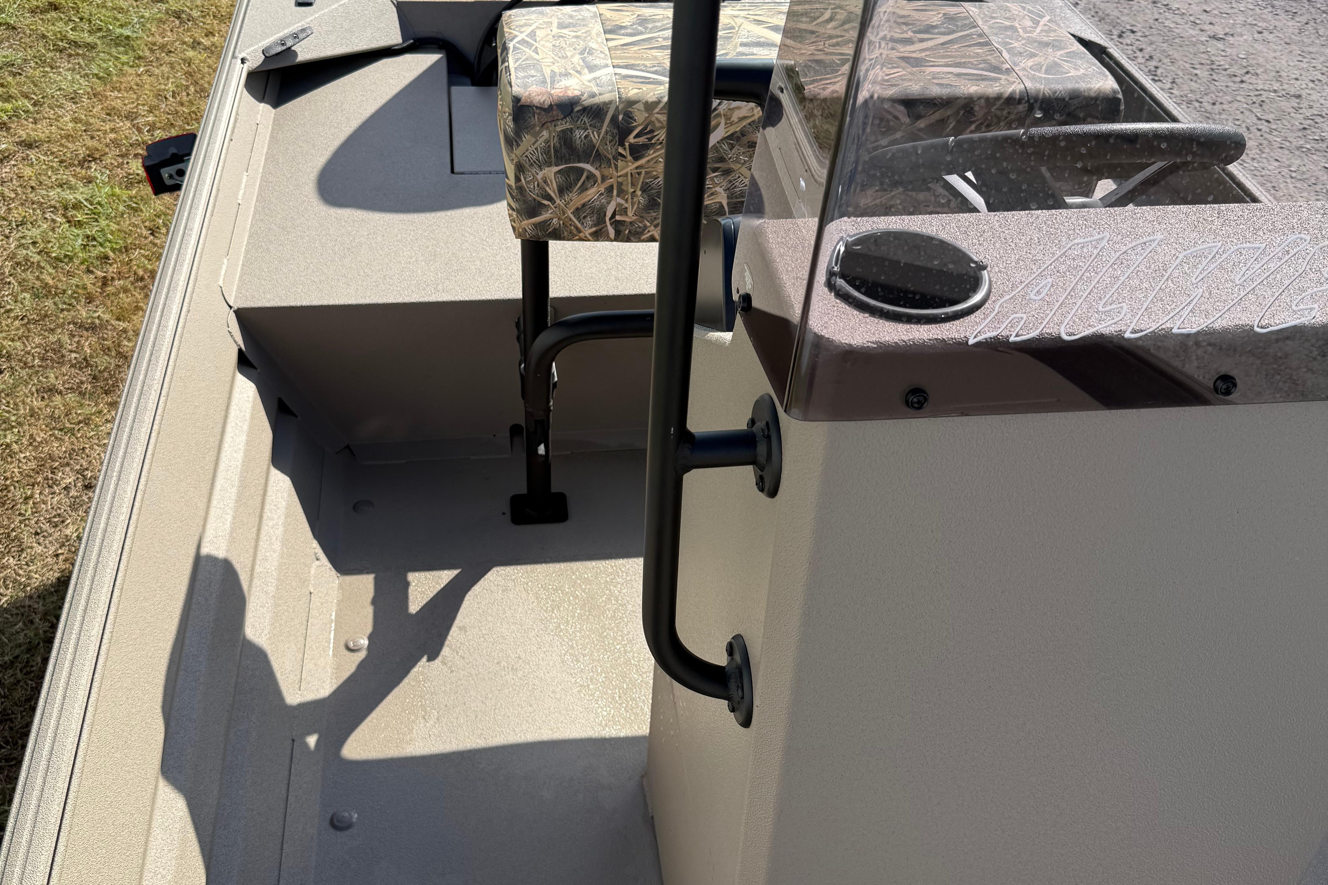 2025 Alweld 1756 V MARSH C.C. boat interior with camo seat and steering console.