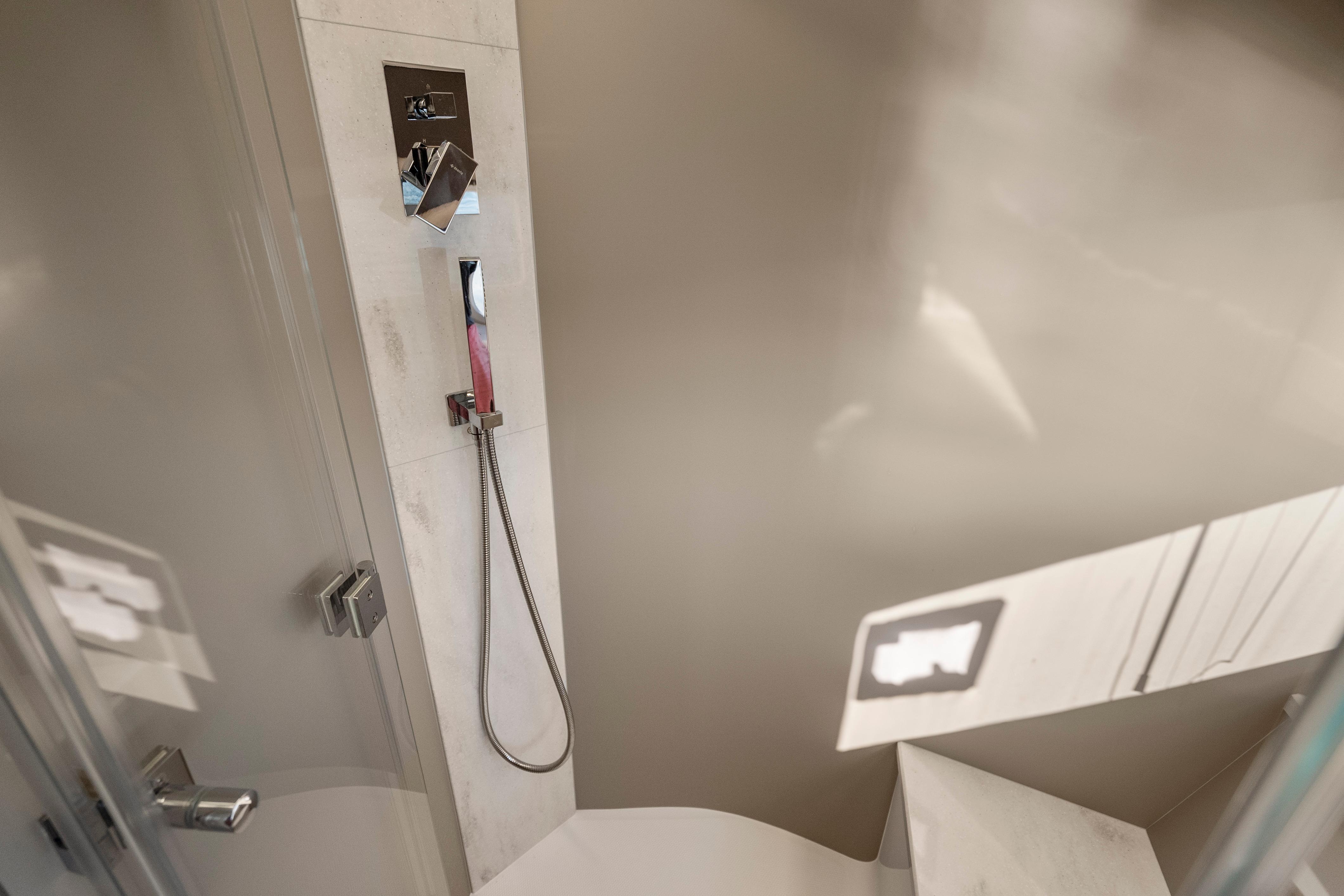 Modern shower area in 2023 Galeon 400 Fly yacht, featuring sleek fixtures and minimalist design.
