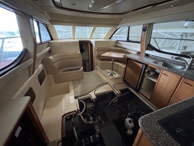 Interior of a 2004 Meridian 341 Sedan with seating area and kitchenette.