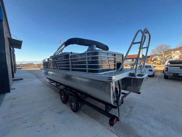 2025 Landau Atlantis 23C Cruise pontoon boat on trailer.