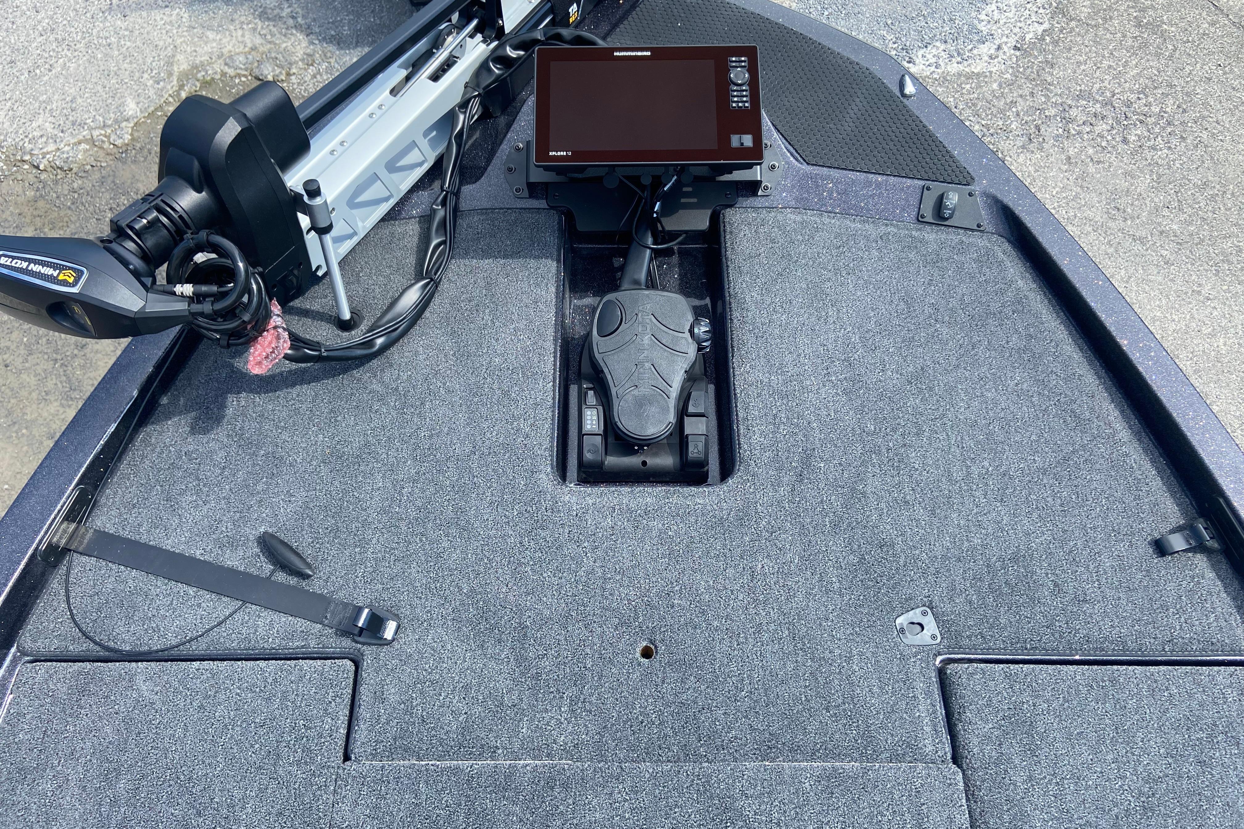Front deck of iKon VLX 20 boat, featuring trolling motor and control panel, 2026 model.