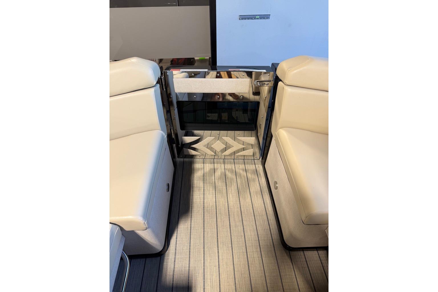 Interior view of 2026 Balise Halo 26C Twin boat with beige seating and patterned flooring.