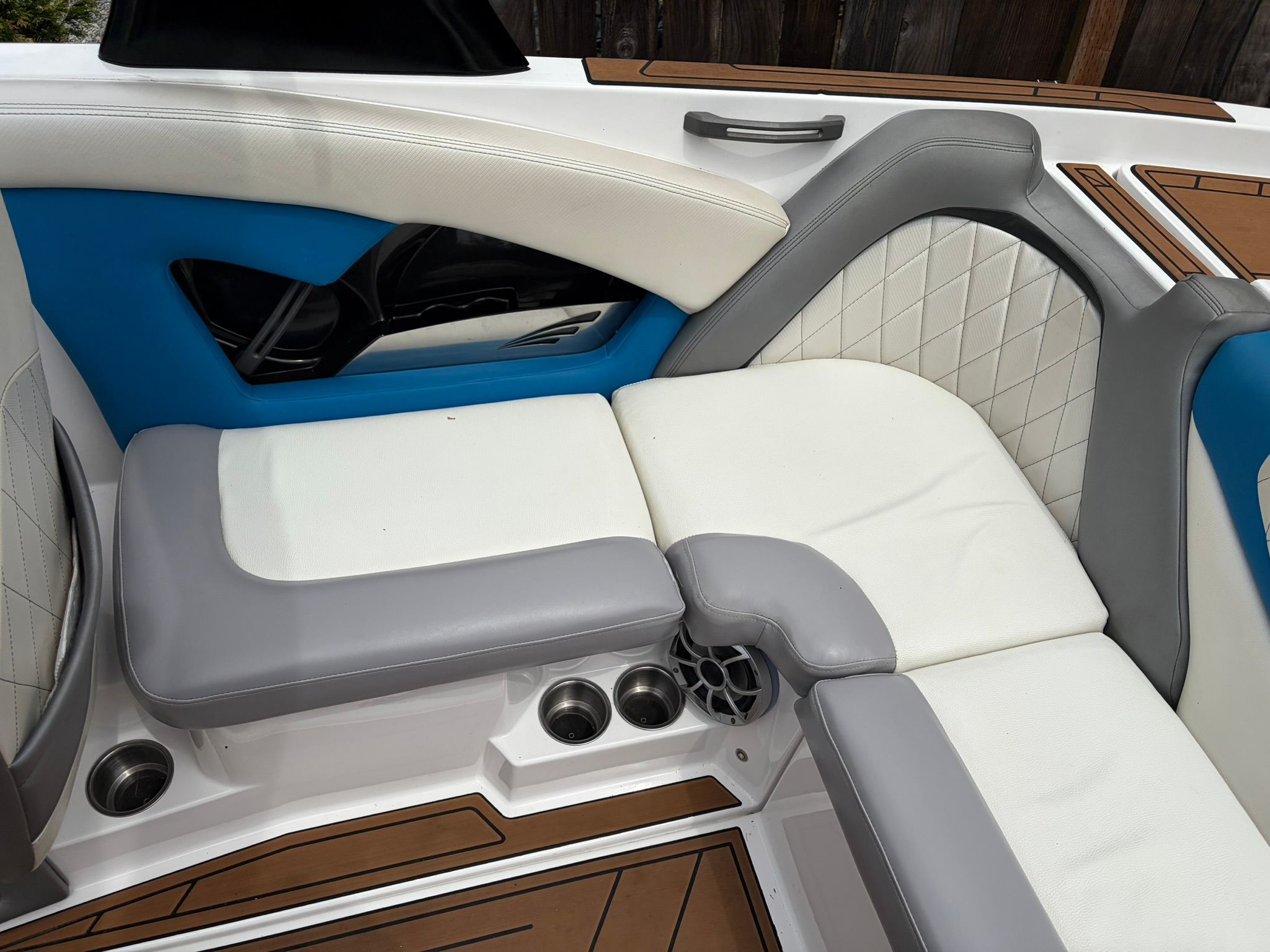 The 2016 Tigé RZ2 interior features white and gray upholstery with blue accents.