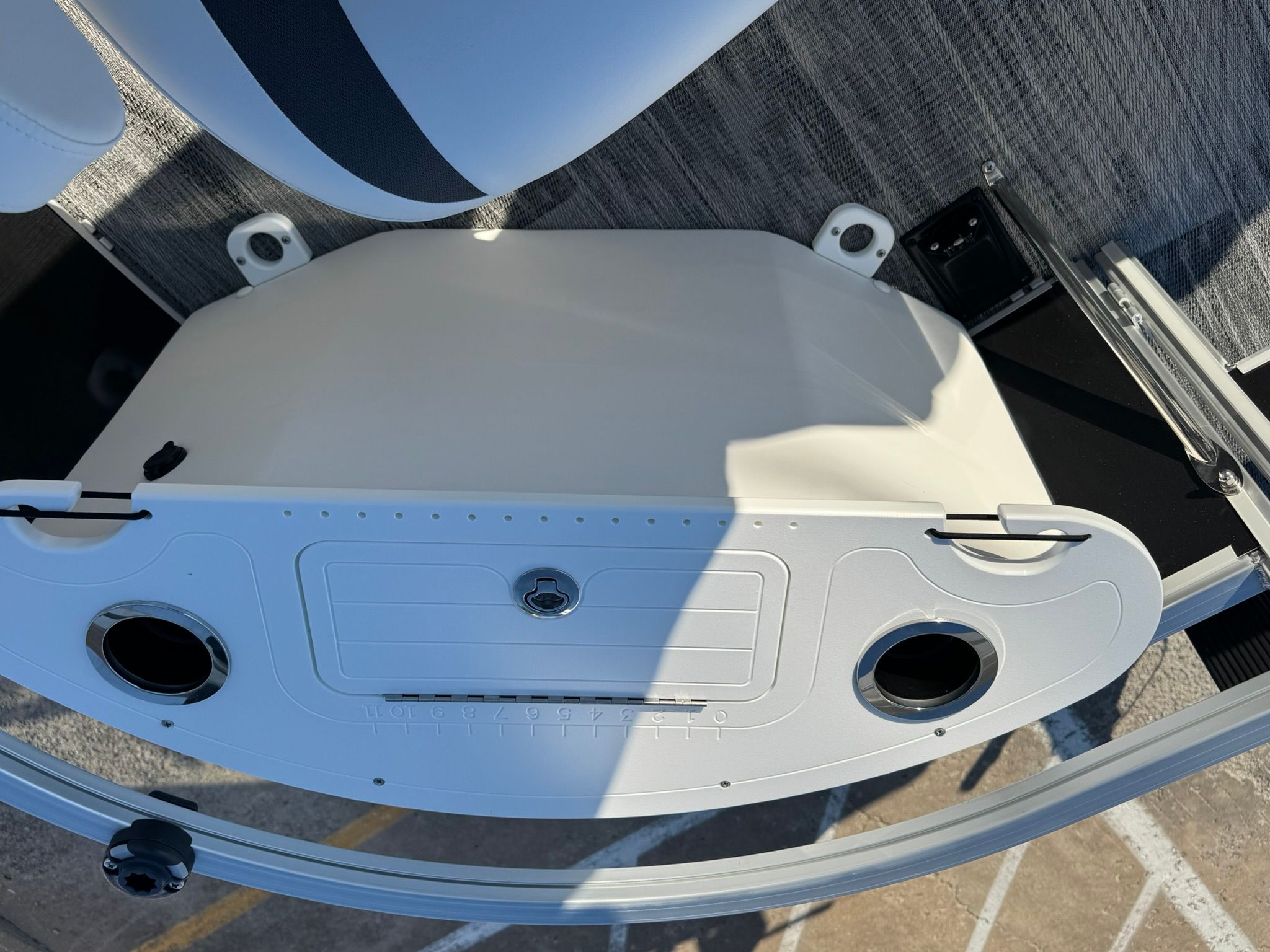Landau 23C Atlantis 2026 boat deck with cup holders.