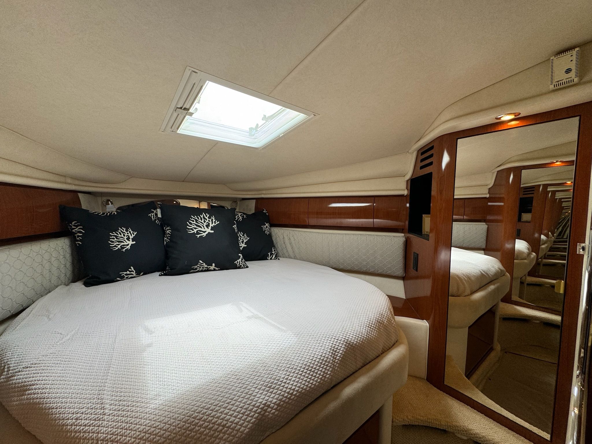 Interior of 2002 Sea Ray 360 Sundancer with cozy bed.