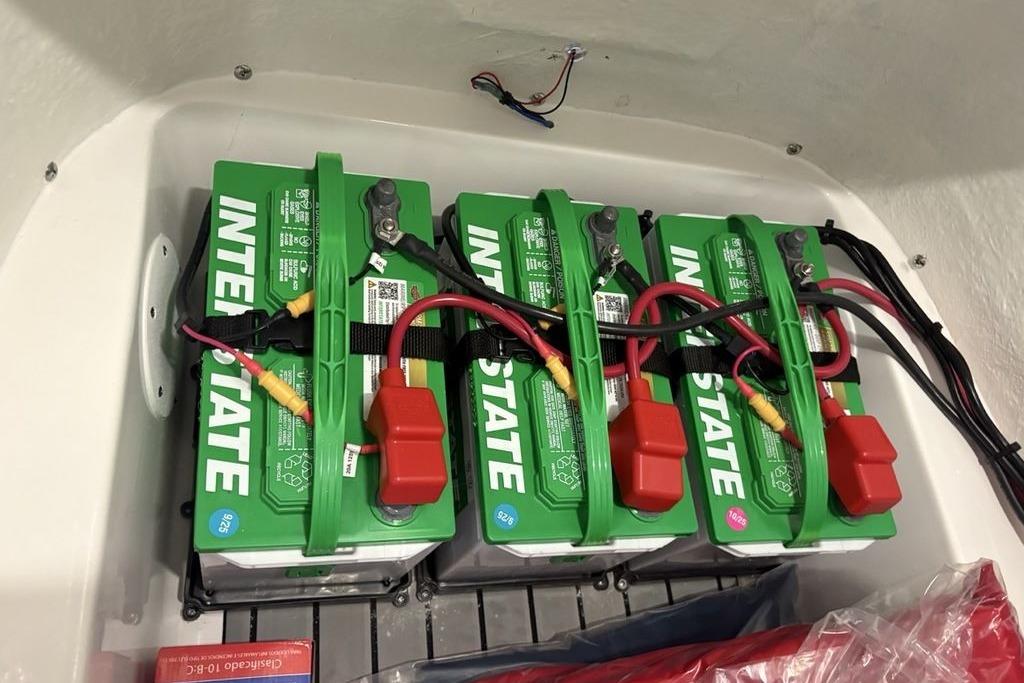 Four Interstate batteries installed in a 2026 Tidewater 2210 Carolina Bay boat.