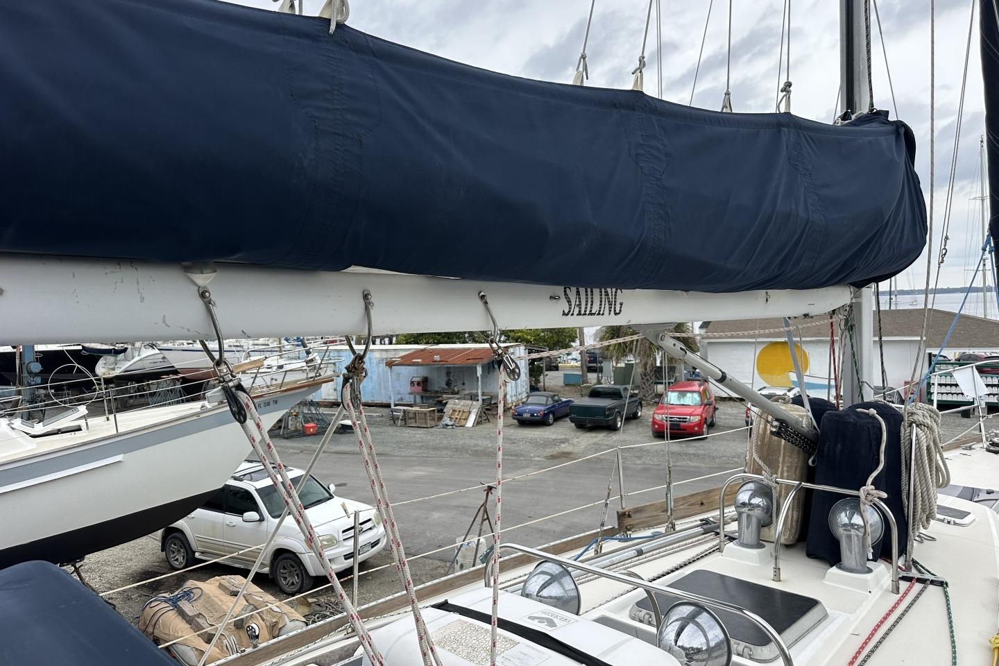 Sailboat Sabre 425 from 1991 docked, featuring covered sails and visible rigging.