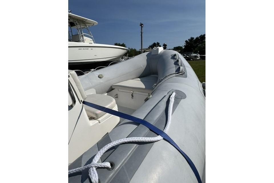 2022 North Atlantic Inflatables RIB420H boat with seating and storage, docked outdoors.