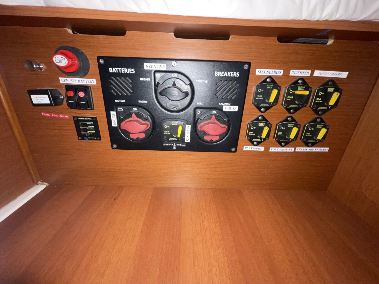 Electrical control panel on a 2020 Beneteau Oceanis 46.1 yacht, featuring battery and breaker switches.