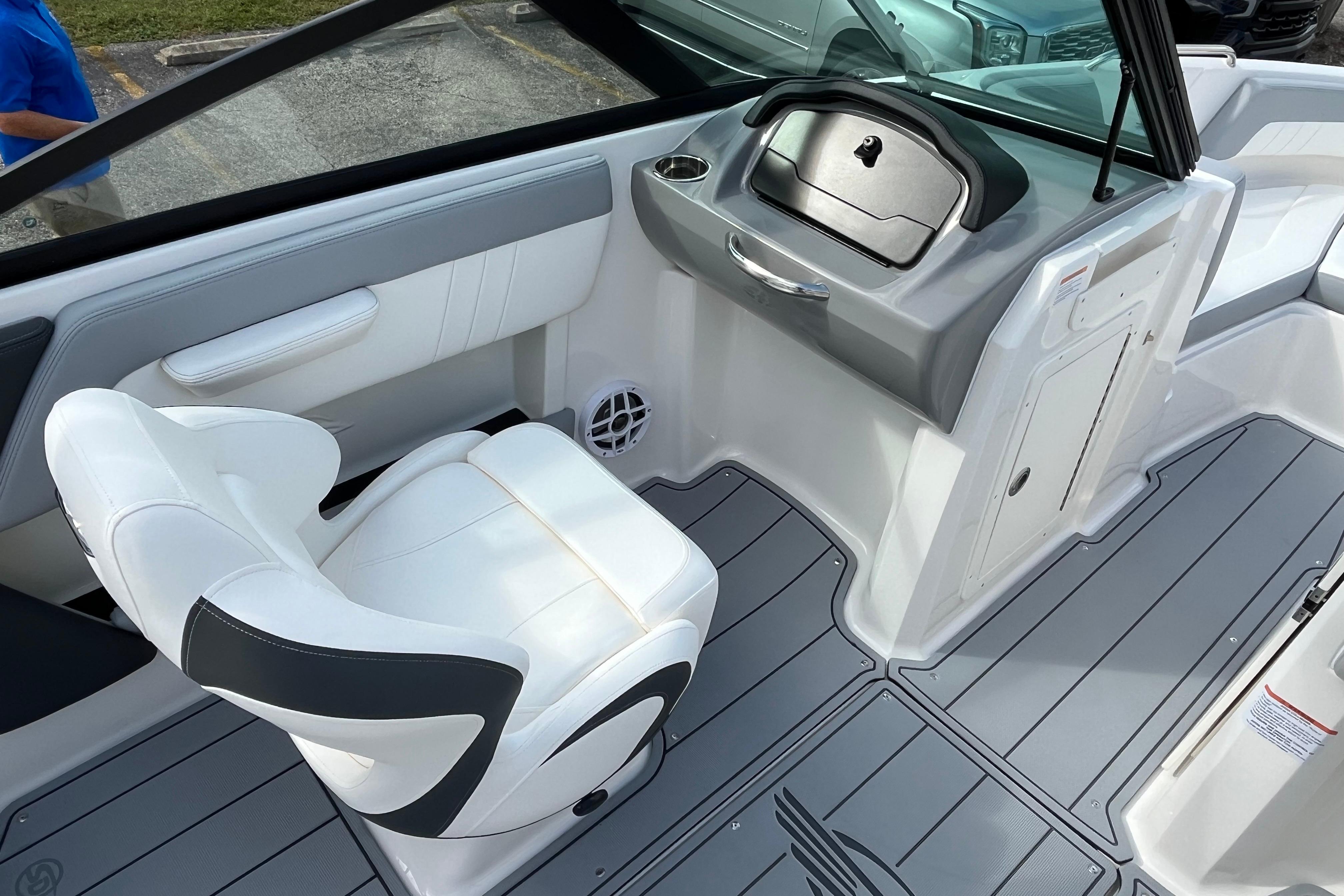 2026 Chaparral 21 SSi boat interior with white seating and gray flooring.