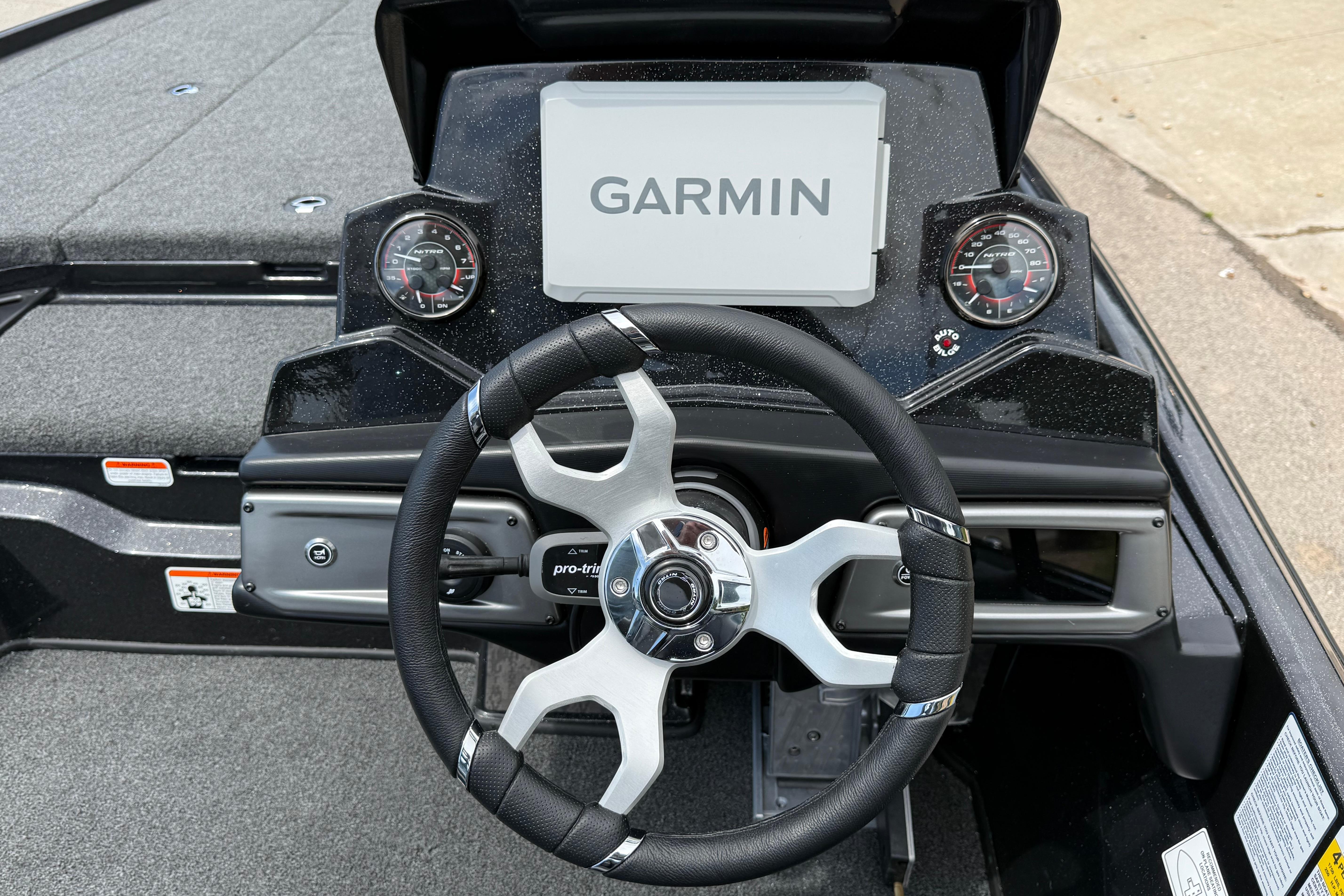 Steering wheel and dashboard of 2026 Nitro Z20 XL Pro boat with Garmin display.