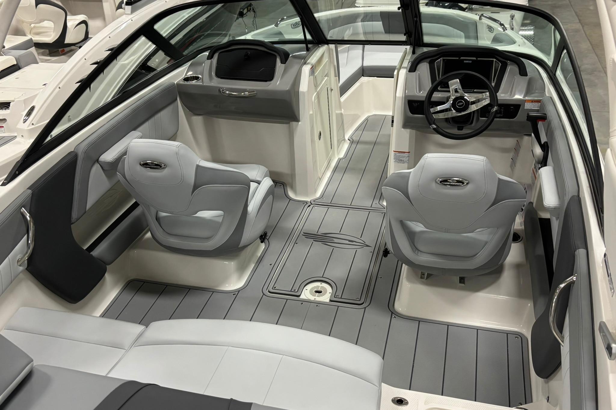 Interior of 2026 Chaparral 21 SSi OB boat with modern seating and steering console.
