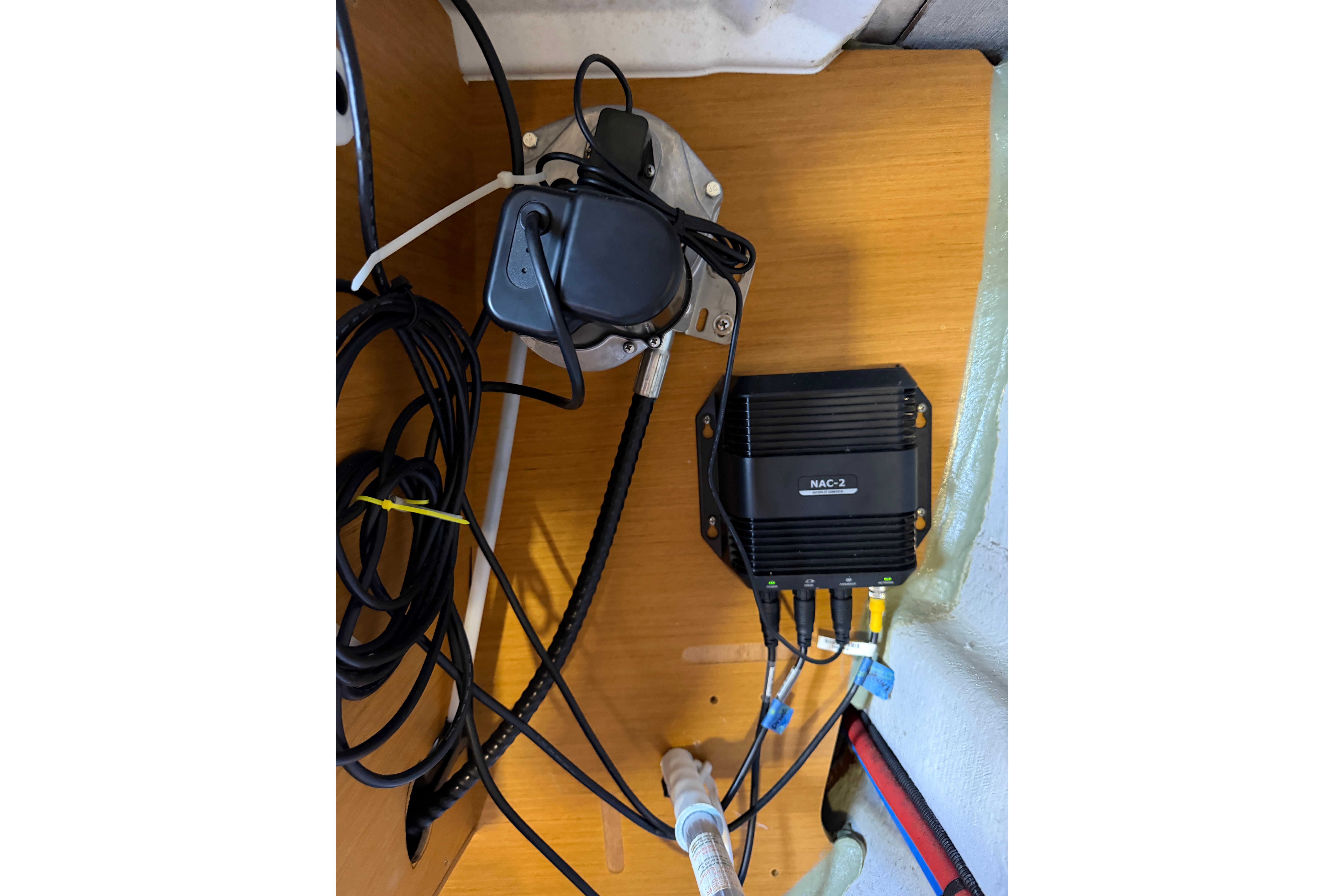 Electrical components and wiring inside a 2015 Jeanneau Sun Odyssey 349 sailboat.