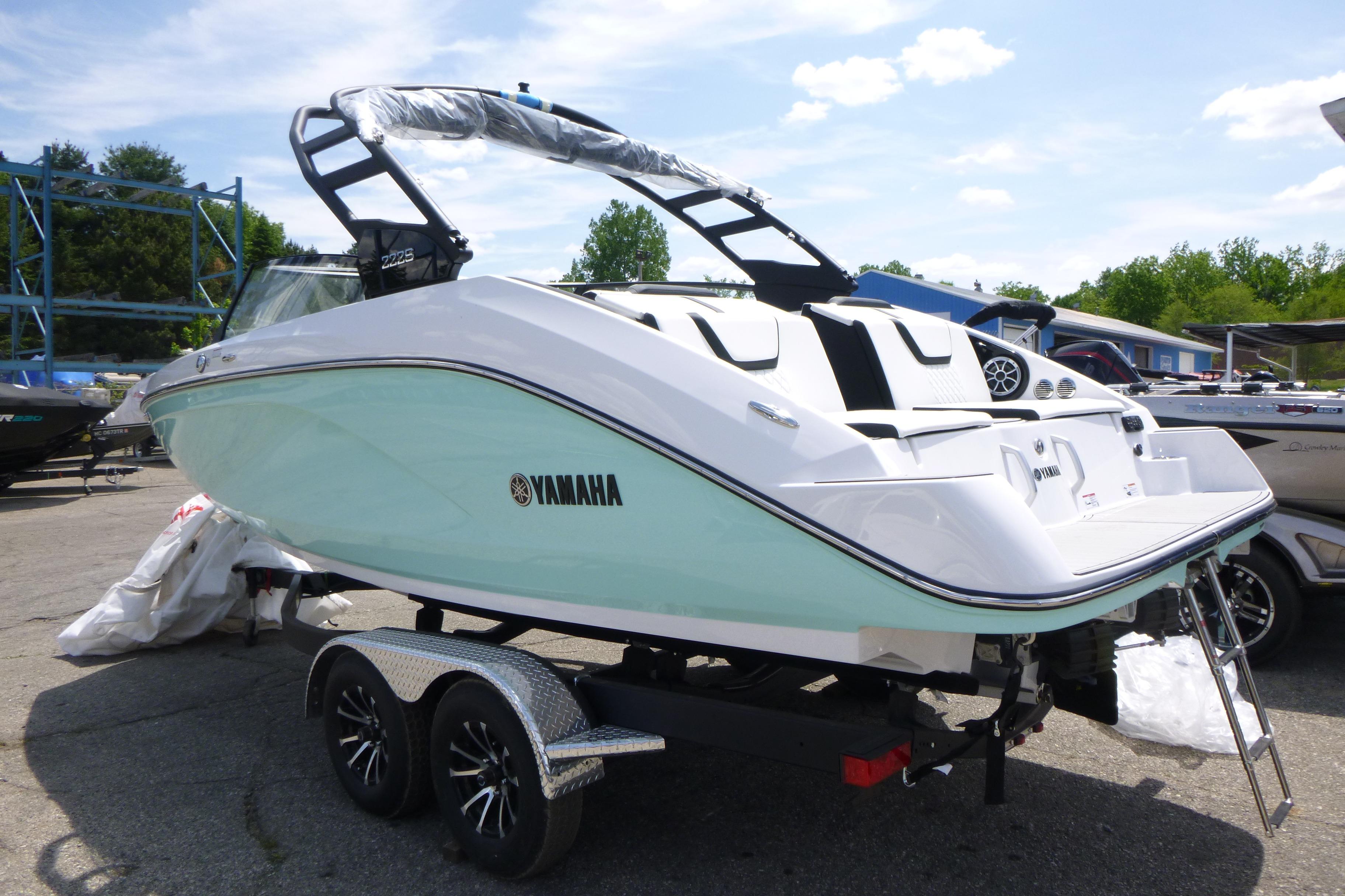 2026 Yamaha Boats 222S on trailer, sleek design, mint green hull, outdoor display.