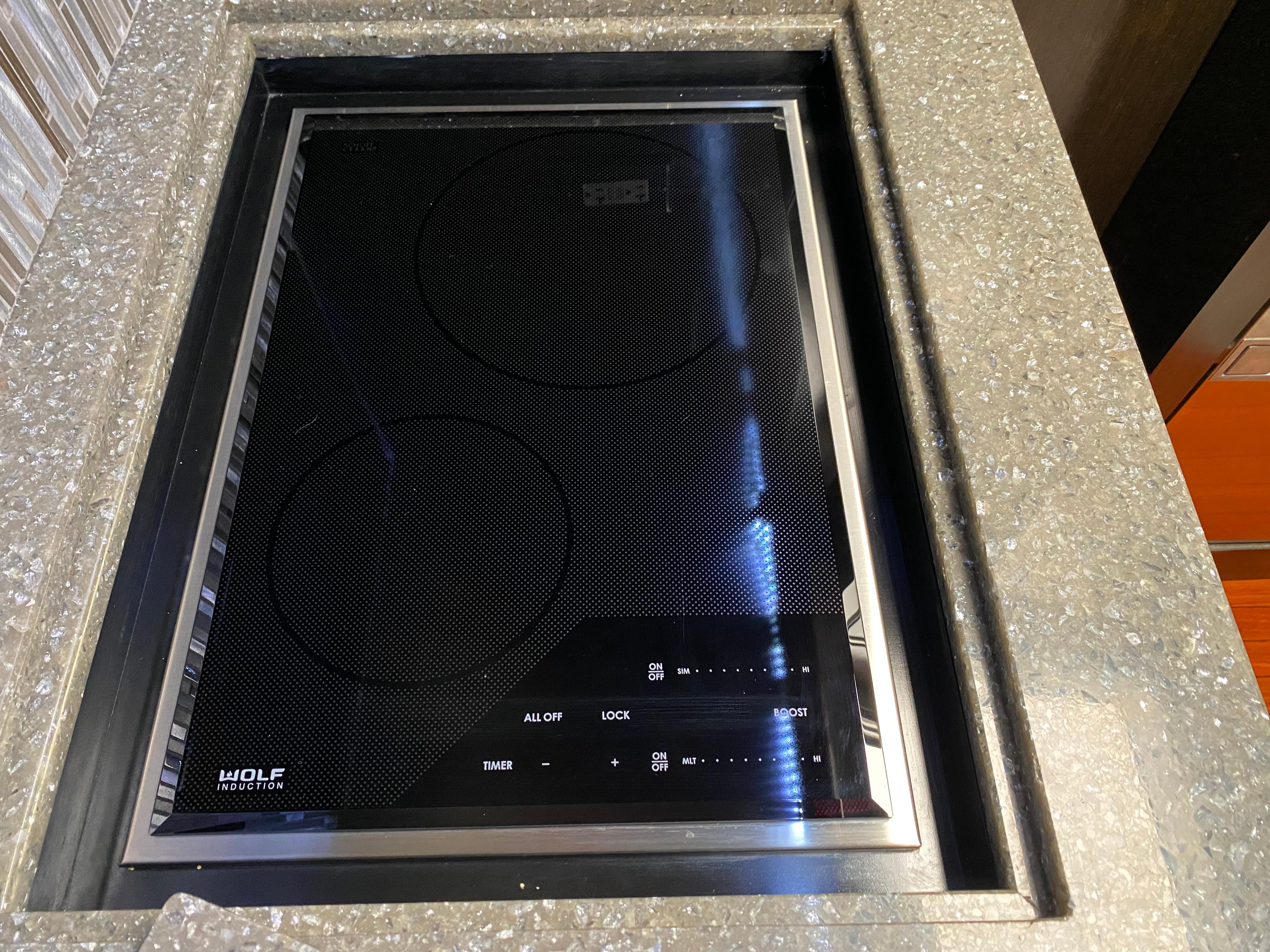 Built-in Wolf induction cooktop on Mares 58 Power Cat, 1995 model.