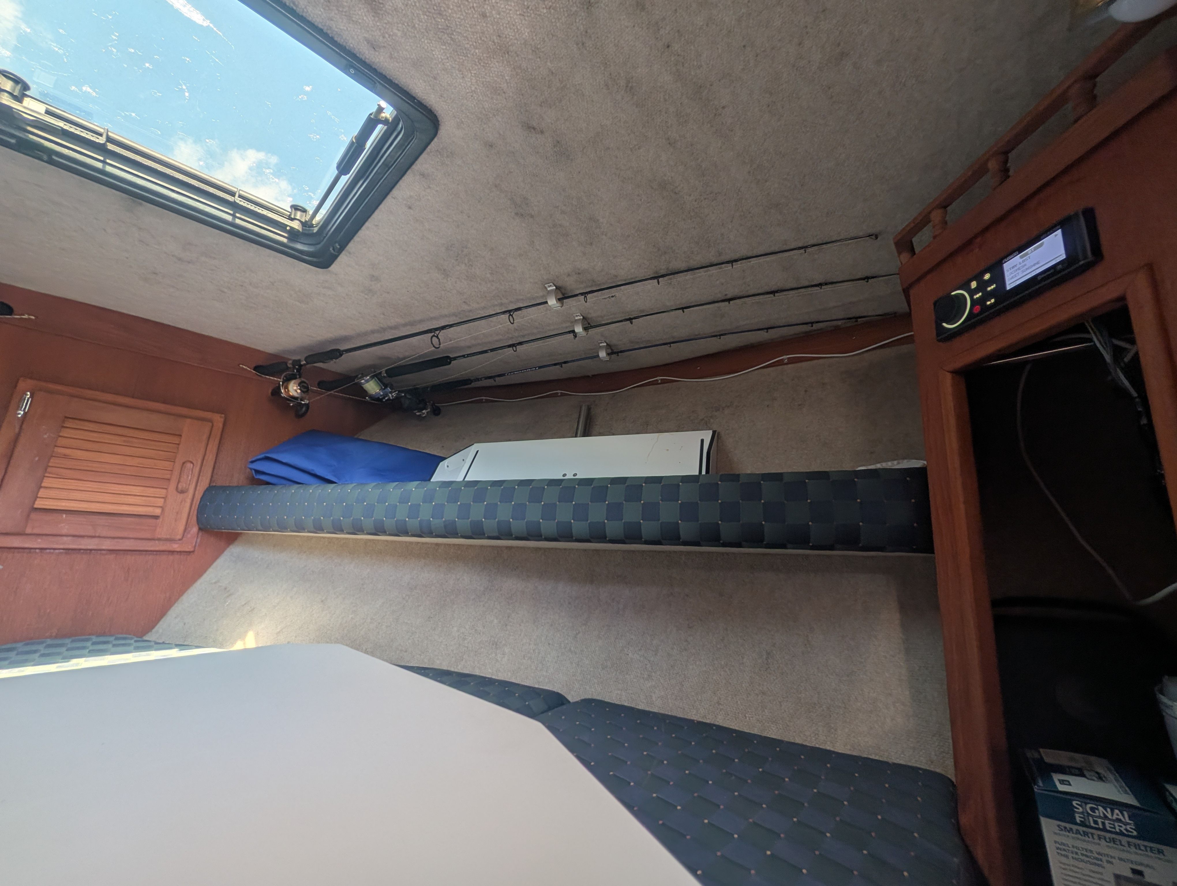Interior of an Albemarle 265 with fishing rods and a radio.
