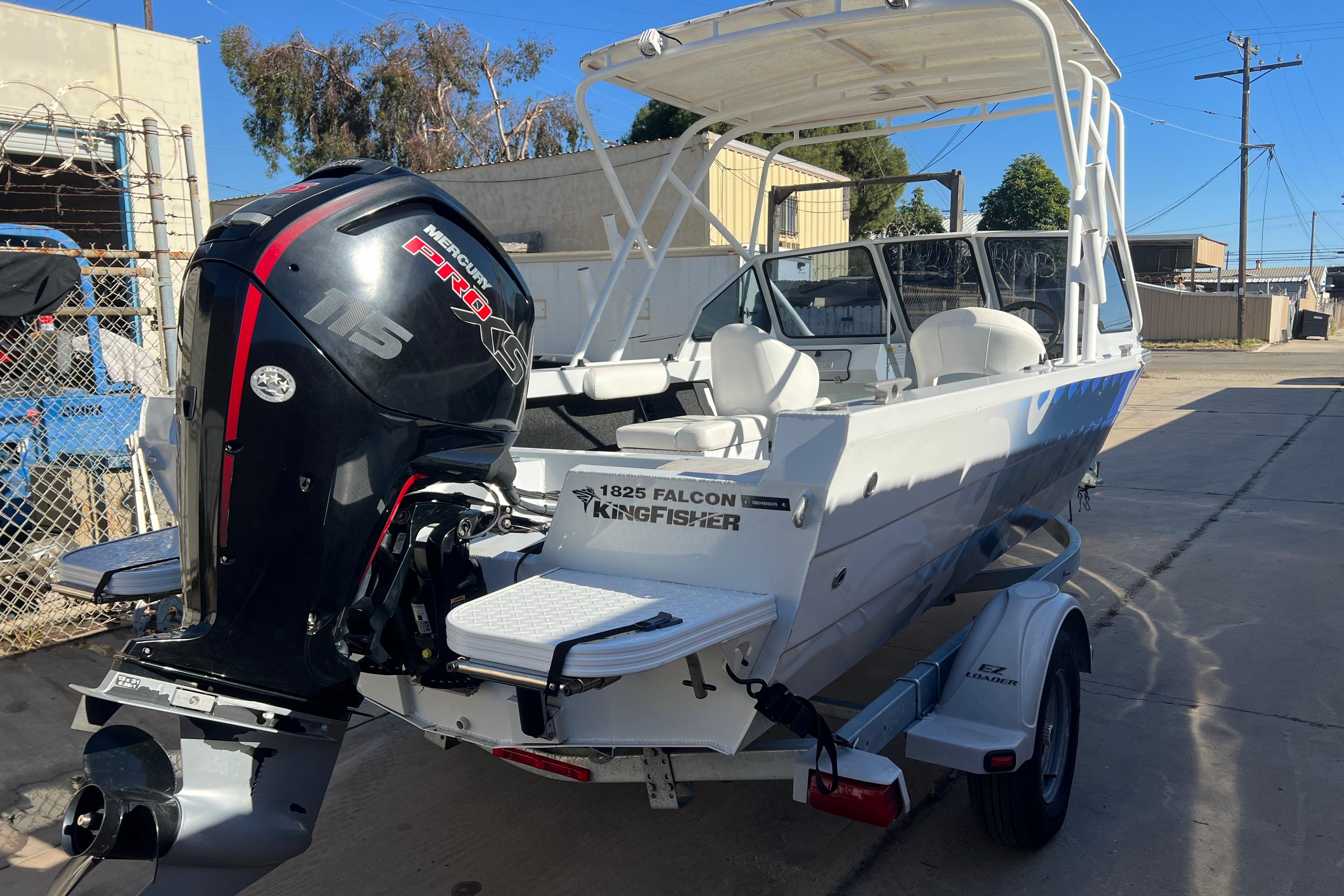 2019 KingFisher 1825 Falcon boat with Mercury 115 Pro XS engine on trailer.