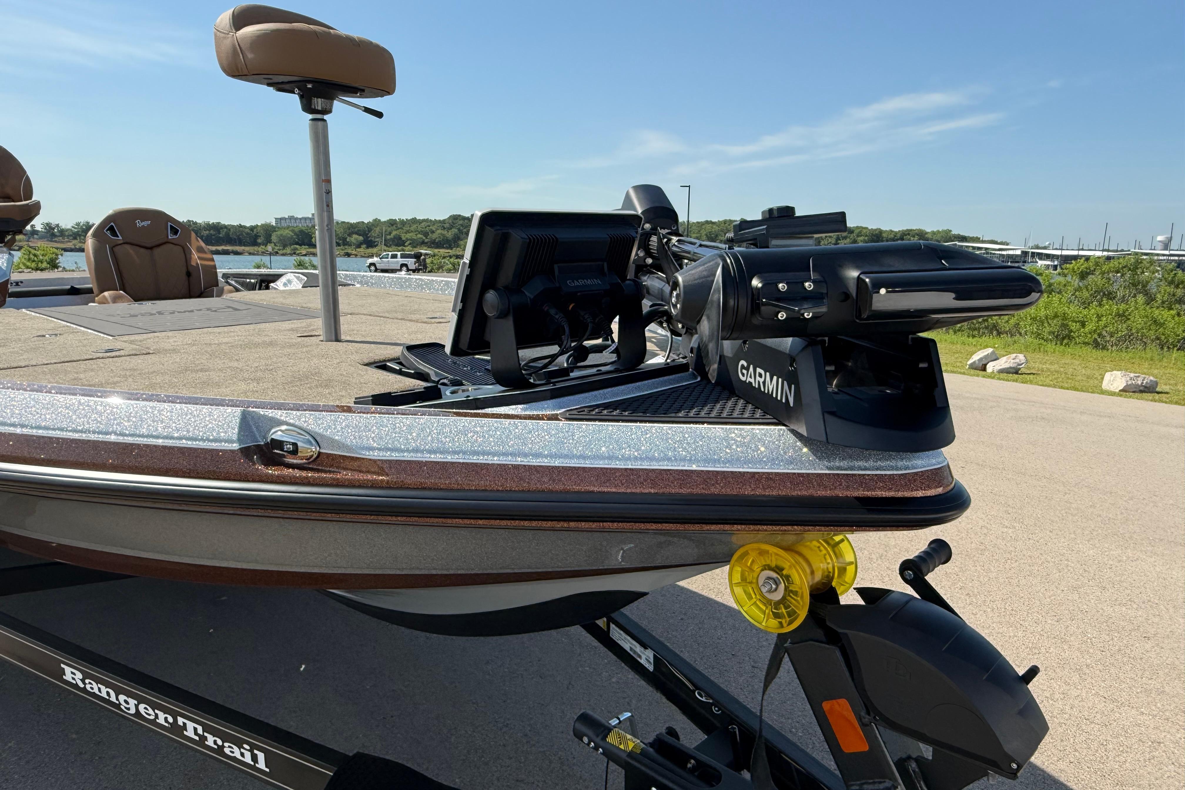 2026 Ranger Z521R boat with Garmin equipment, parked near a scenic waterfront.