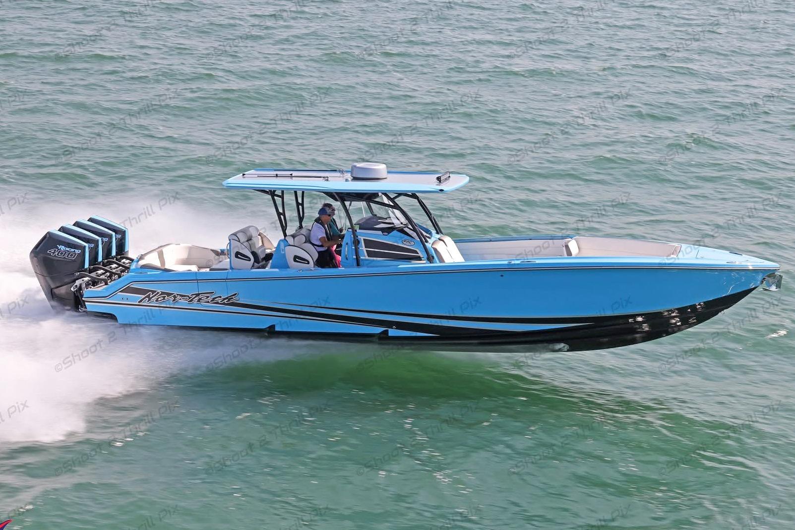 2025 Nor-Tech 390 Sport Center Console boat cruising on open water.